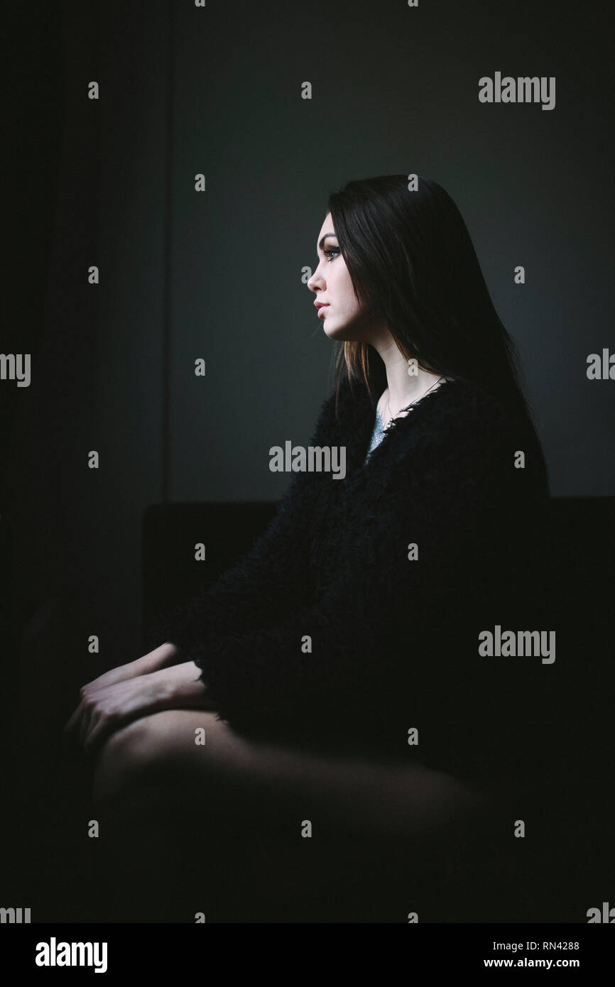 Young woman in black coat hi-res stock photography and images - Alamy
