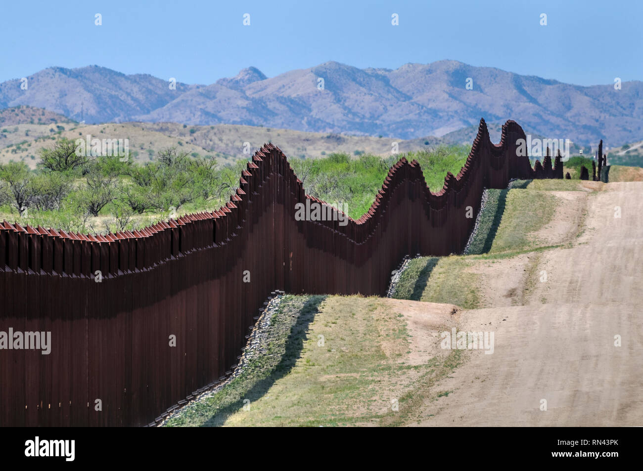 US border fence on Mexico boundary, bollard style pedestrian barrier, viewed from US side toward Mexican mountains,east of Nogales Arizona, April 2018 Stock Photo