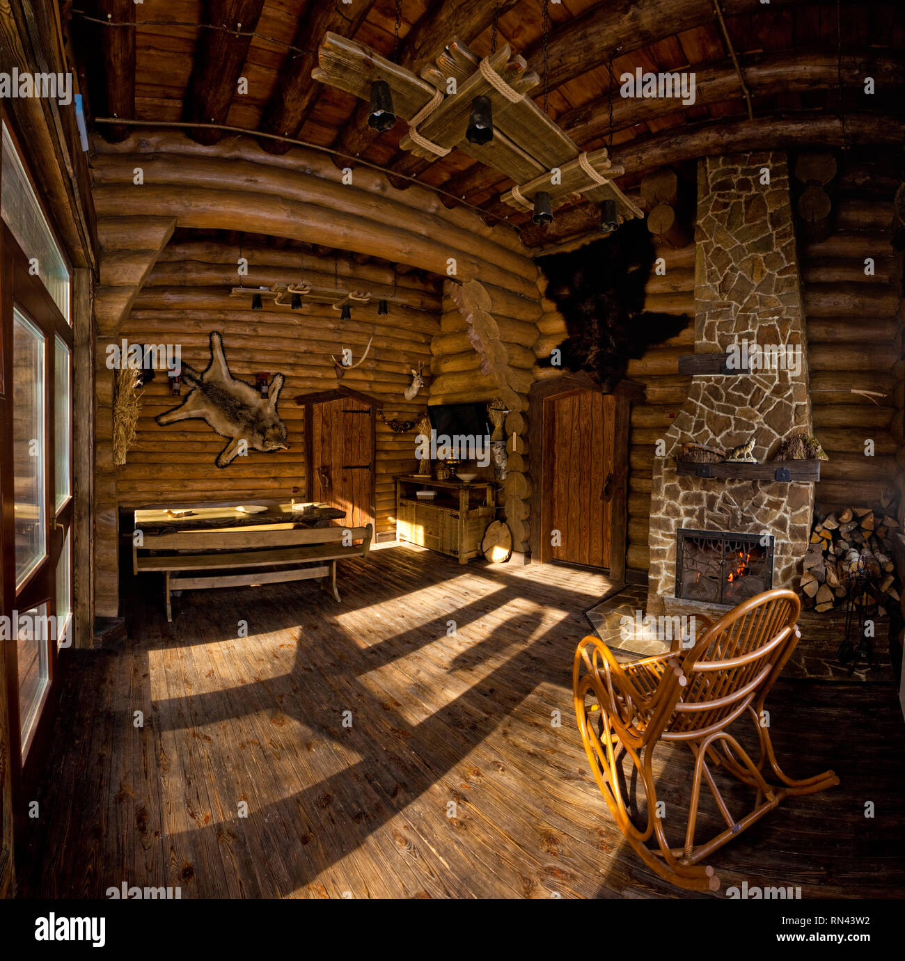 Country Style Interior In Hunter Chalet With Fireplace Stock Photo