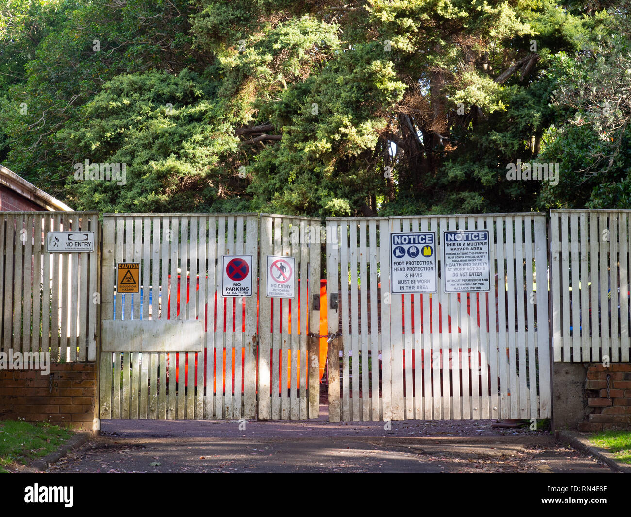 No Access Signs On White Gates Across A Driveway Stock Photo