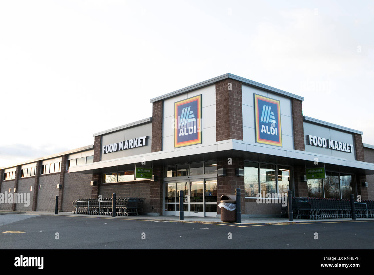 A logo sign outside of a Aldi retail grocery store in Winchester