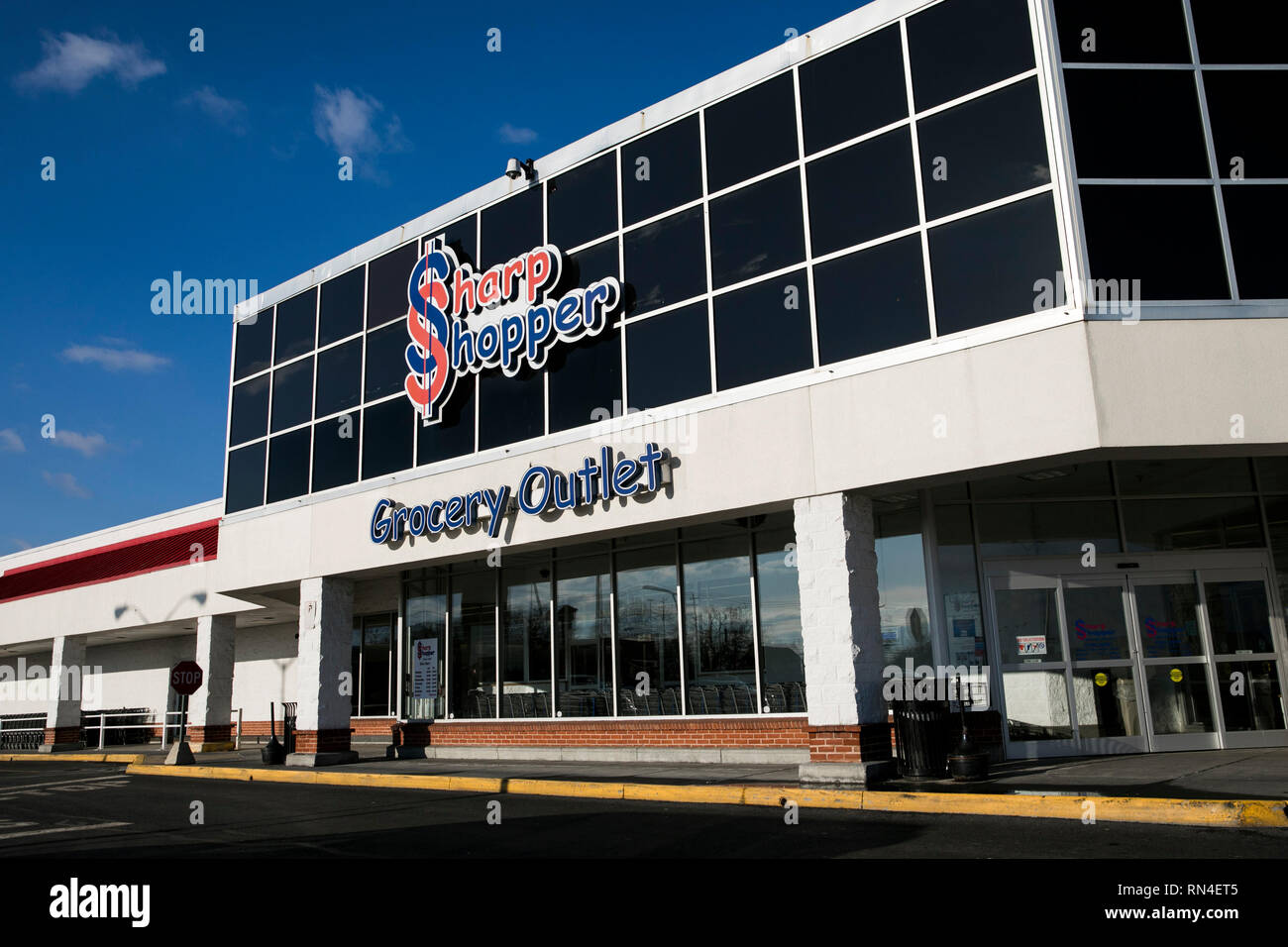 A logo sign outside of a Sharp Shopper Grocery Outlet store location in