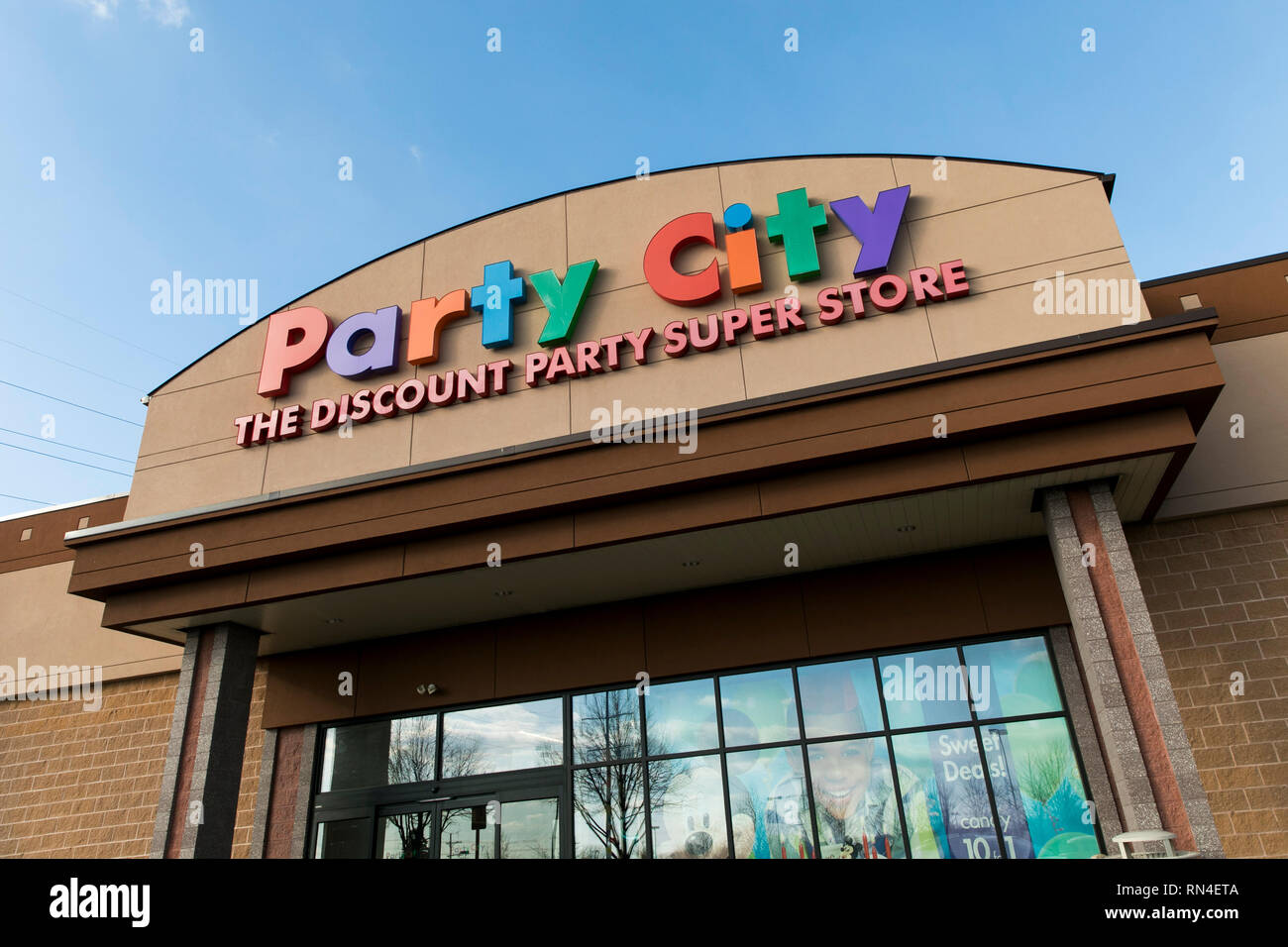 A logo sign outside of a Party City retail store location in Winchester, Virginia on February 13, 2019. Stock Photo