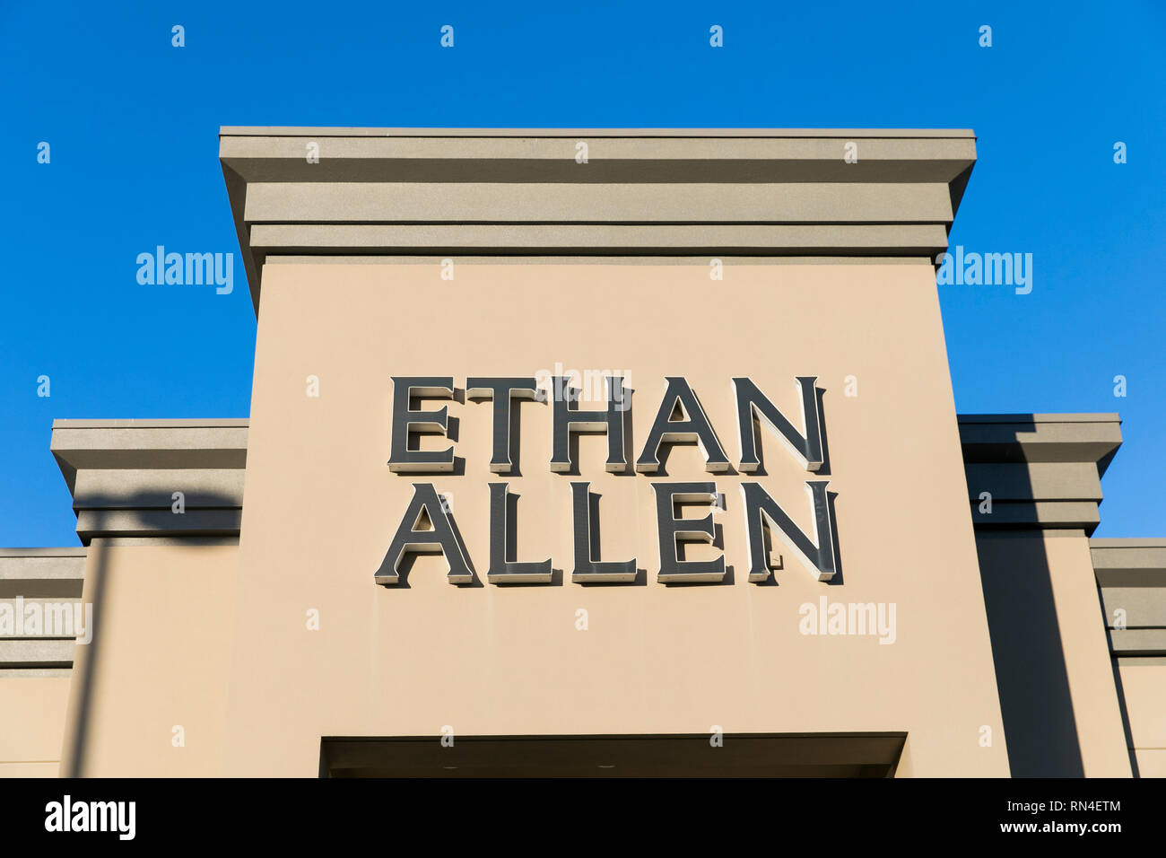 A logo sign outside of a Ethan Allen retail store location in Sterling, Virginia on February 14, 2019. Stock Photo
