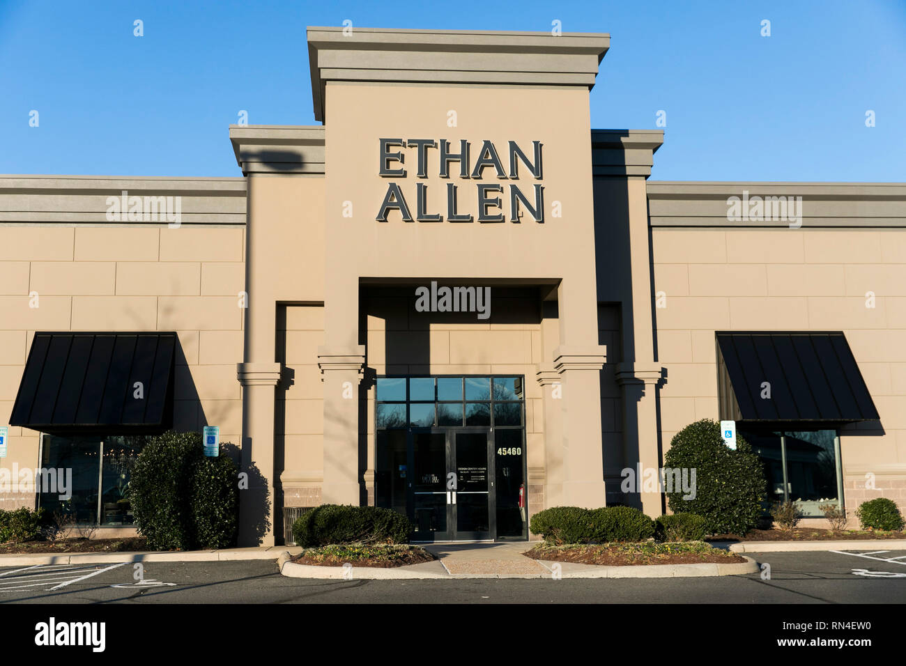 A logo sign outside of a Ethan Allen retail store location in Sterling, Virginia on February 14, 2019. Stock Photo