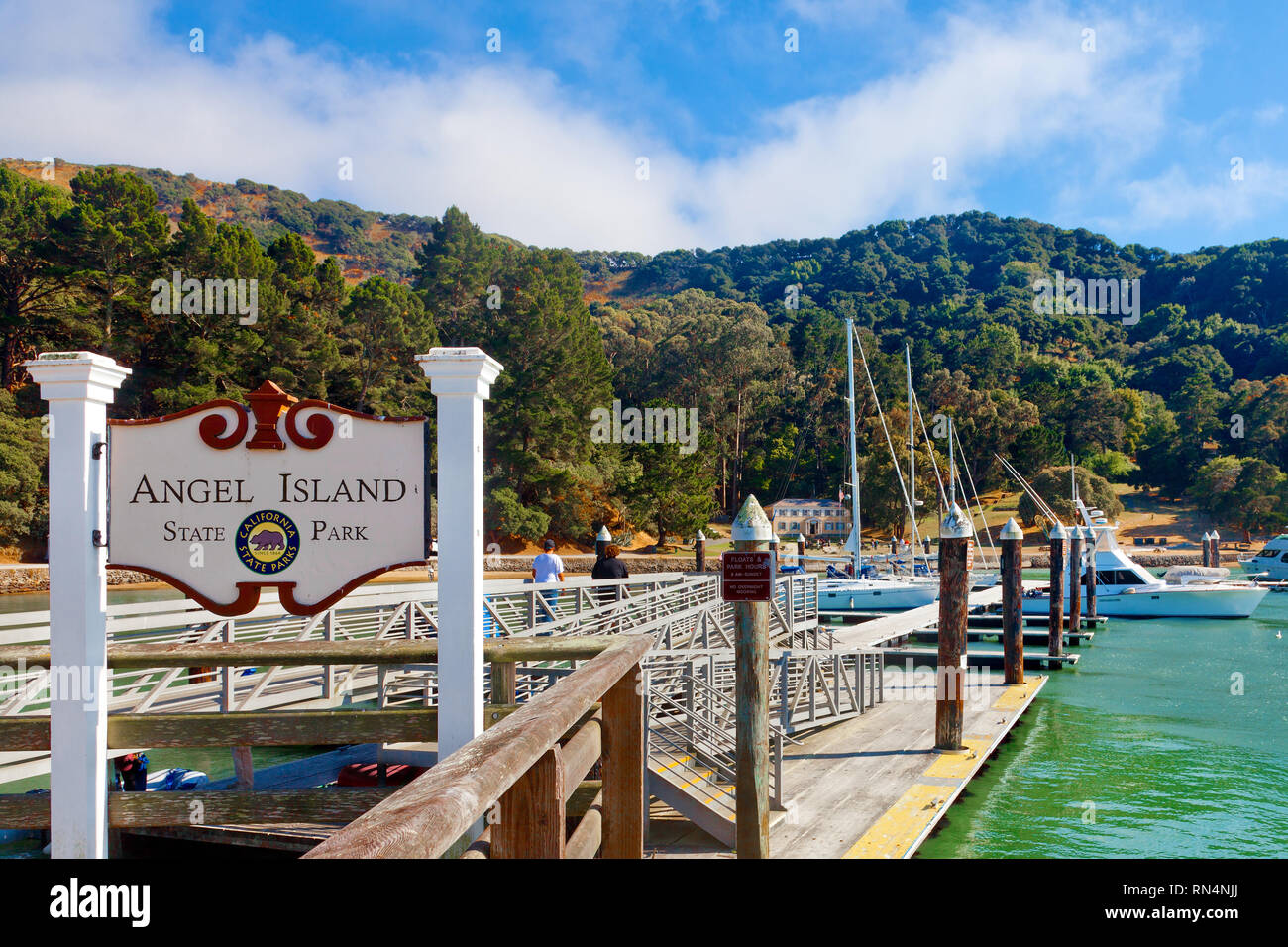 San Francisco Angel Island State Park, reachable only by boat. Sign greets visitors at the harbor dock. Stock Photo