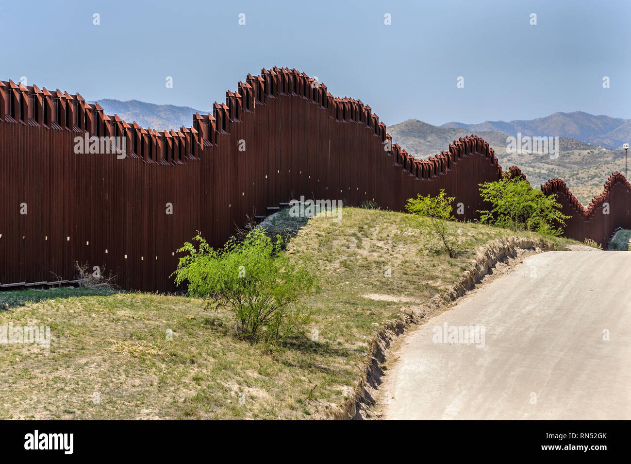 US border fence on Mexico boundary, tall bollard style pedestrian barrier, viewed from US side looking west, east of Nogales Arizona, April 2018 Stock Photo