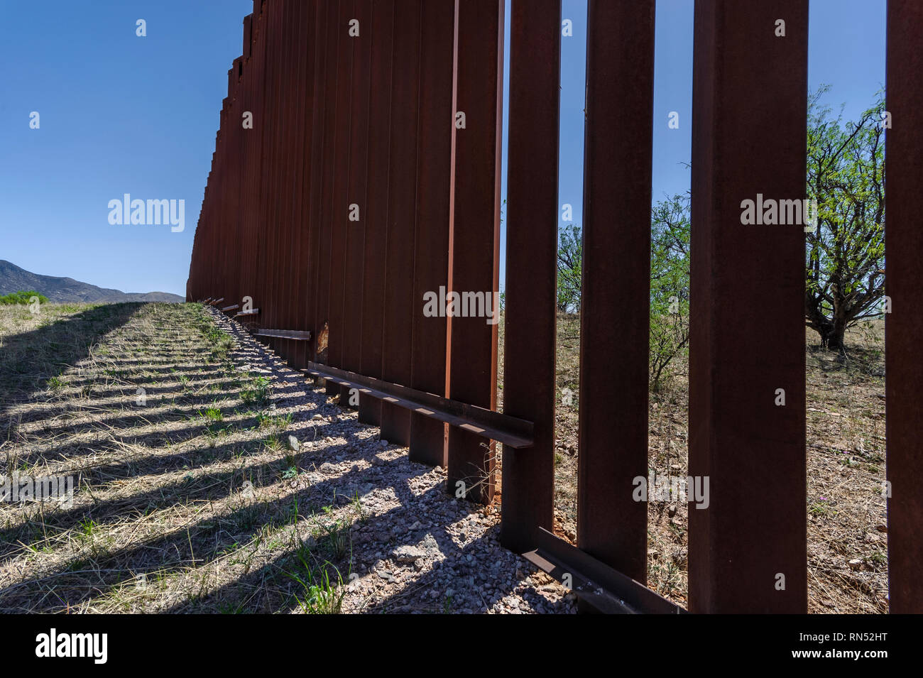 US border fence on Mexico boundary, tall bollard style pedestrian barrier, viewed from US side, east of Nogales Arizona, April 2018 Stock Photo