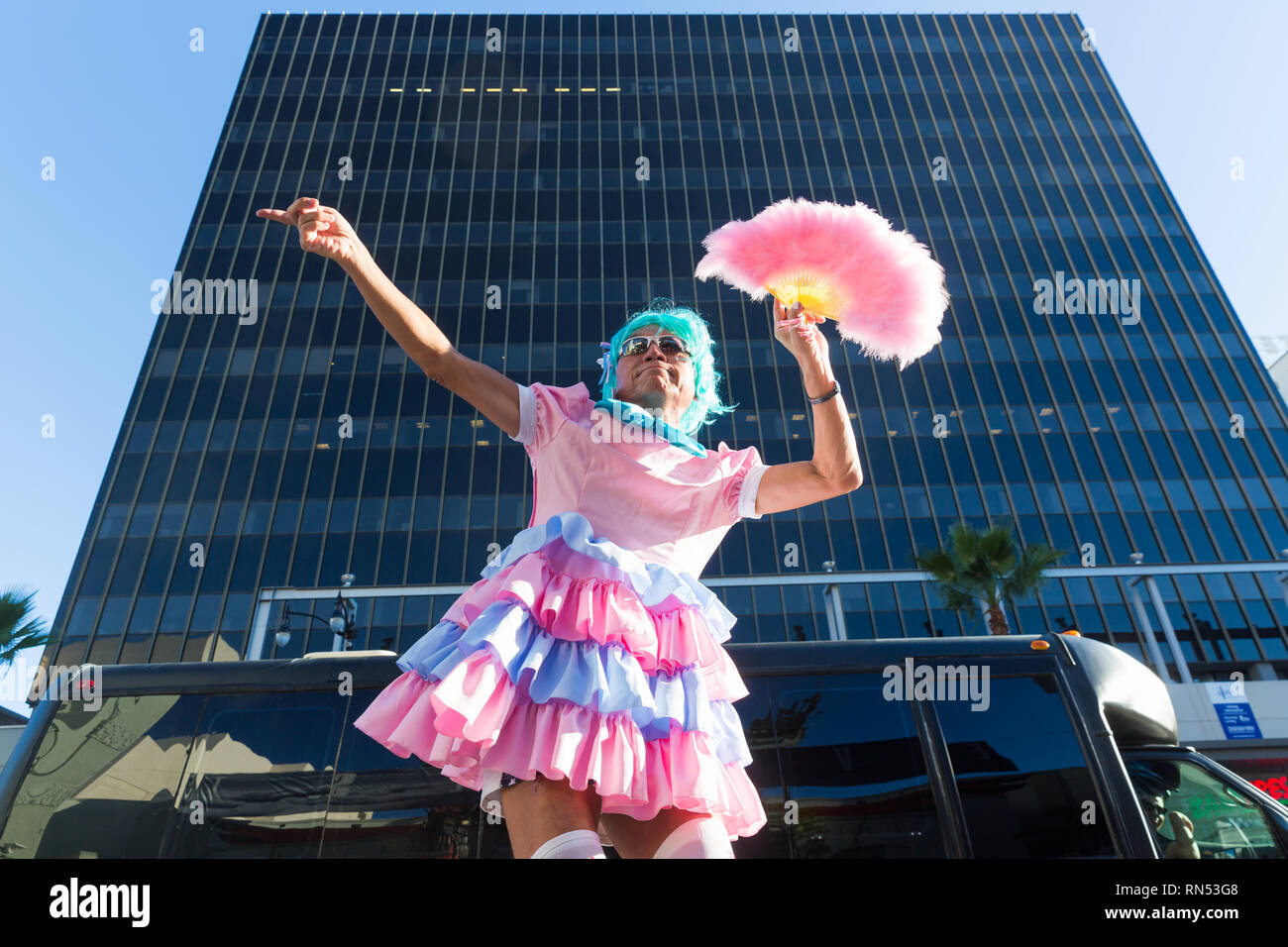 Performer dancing in flamboyant pastel costume on the Hollywood Walk of Fame in Los Angeles, California. Stock Photo