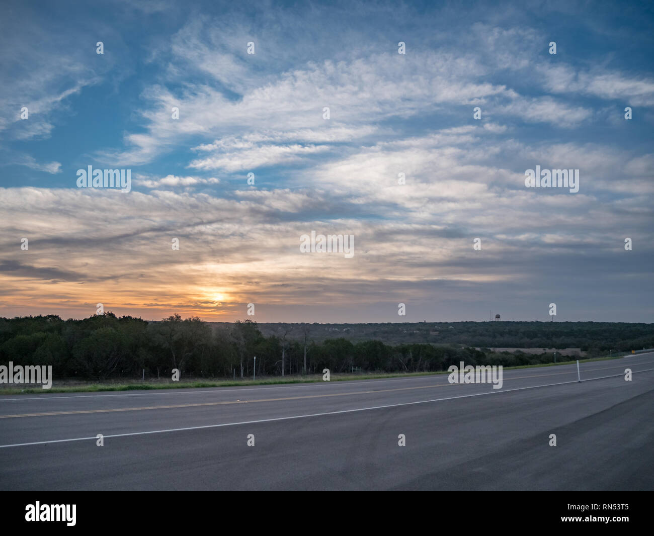 Sunrise Over New Texas Road Stock Photo Alamy
