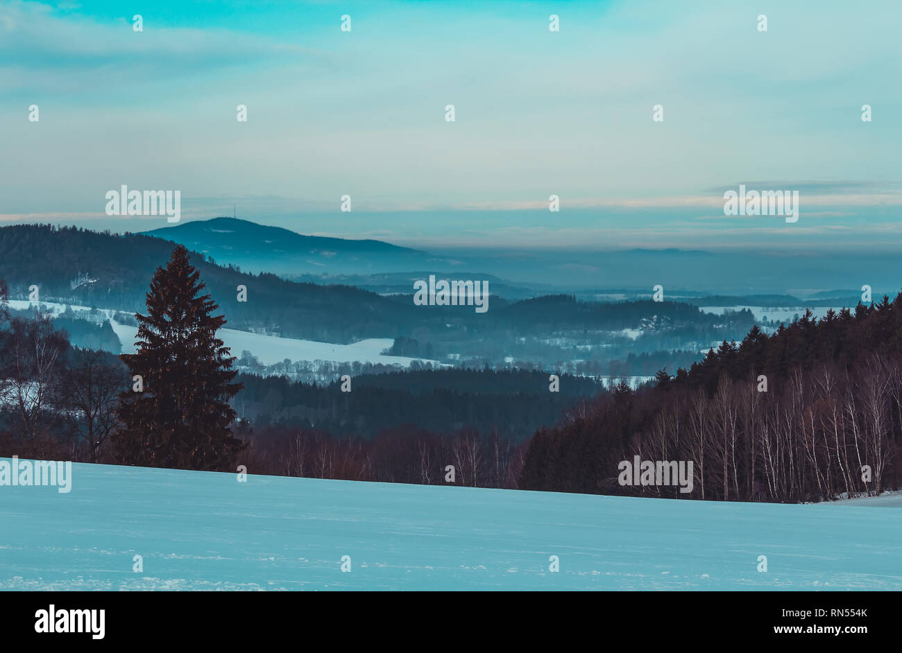Nice Czech winter valley landscape with trees and hill Stock Photo