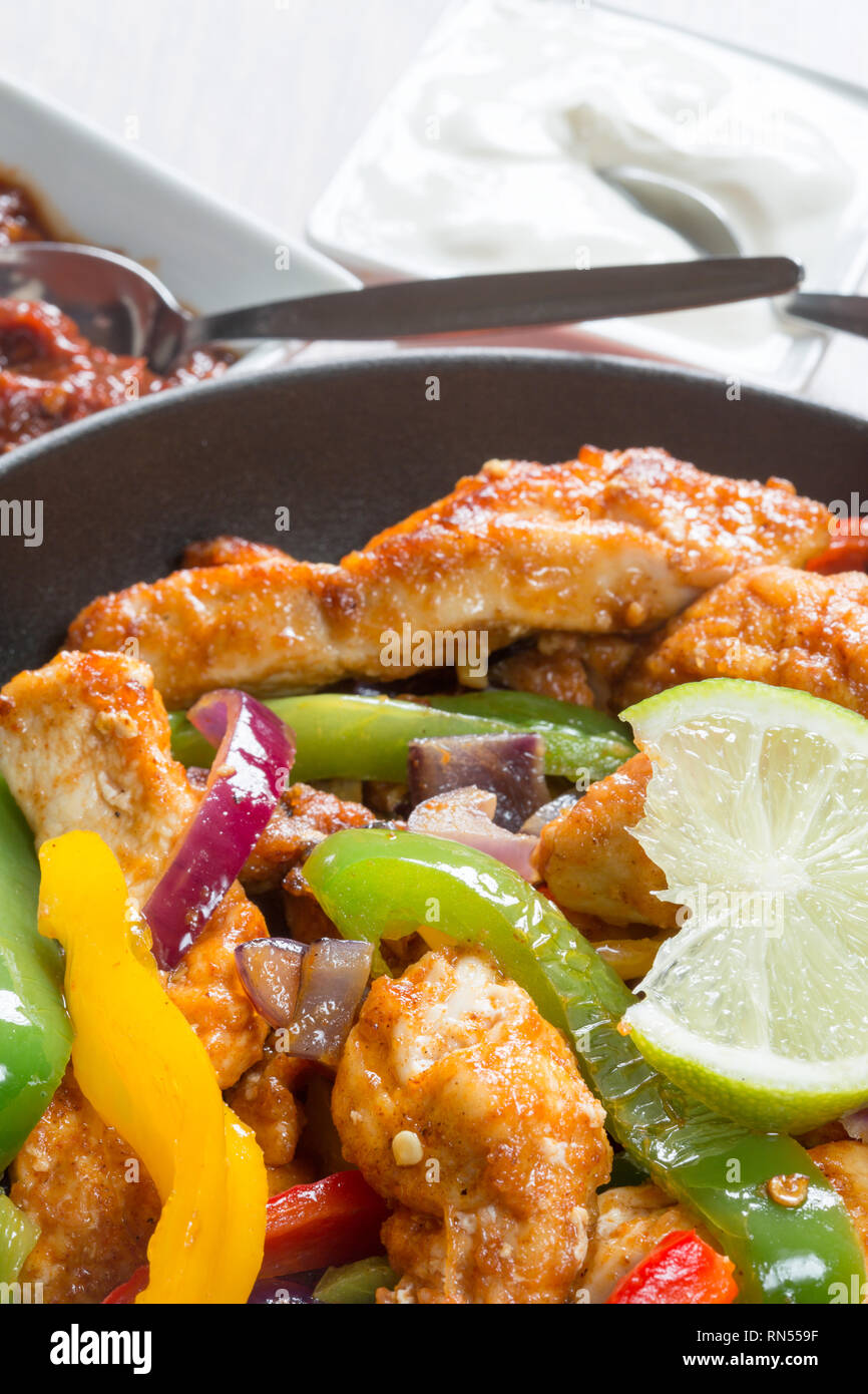 Cooked Chicken fajita in the pan ready to serve. Stock Photo