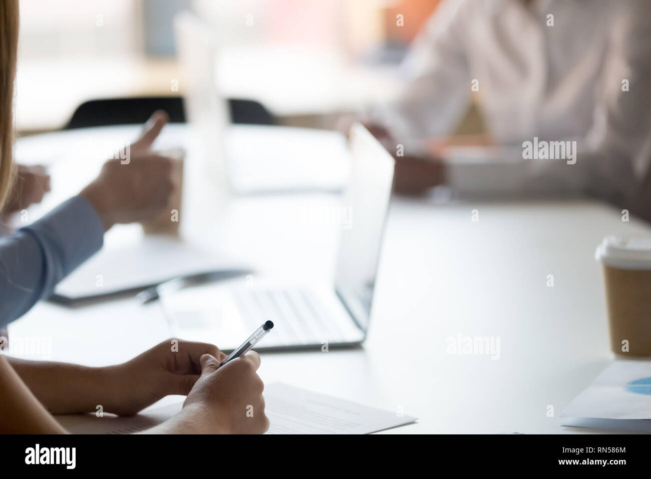 Businesspeople sitting at desk solve issues closeup of people hands Stock Photo