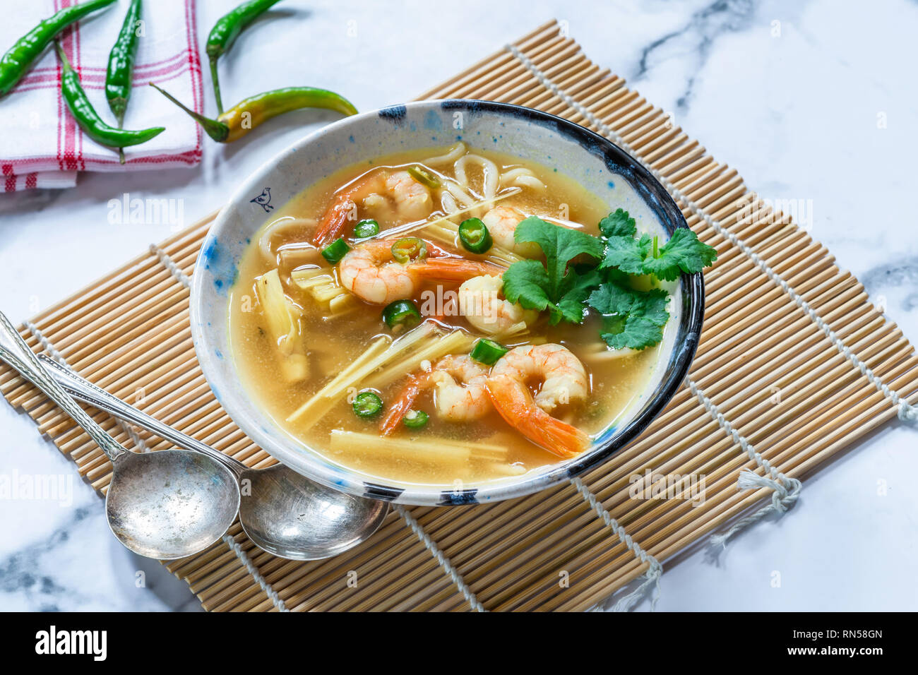 Tom yum - hot and sour Thai soup with prawns Stock Photo - Alamy