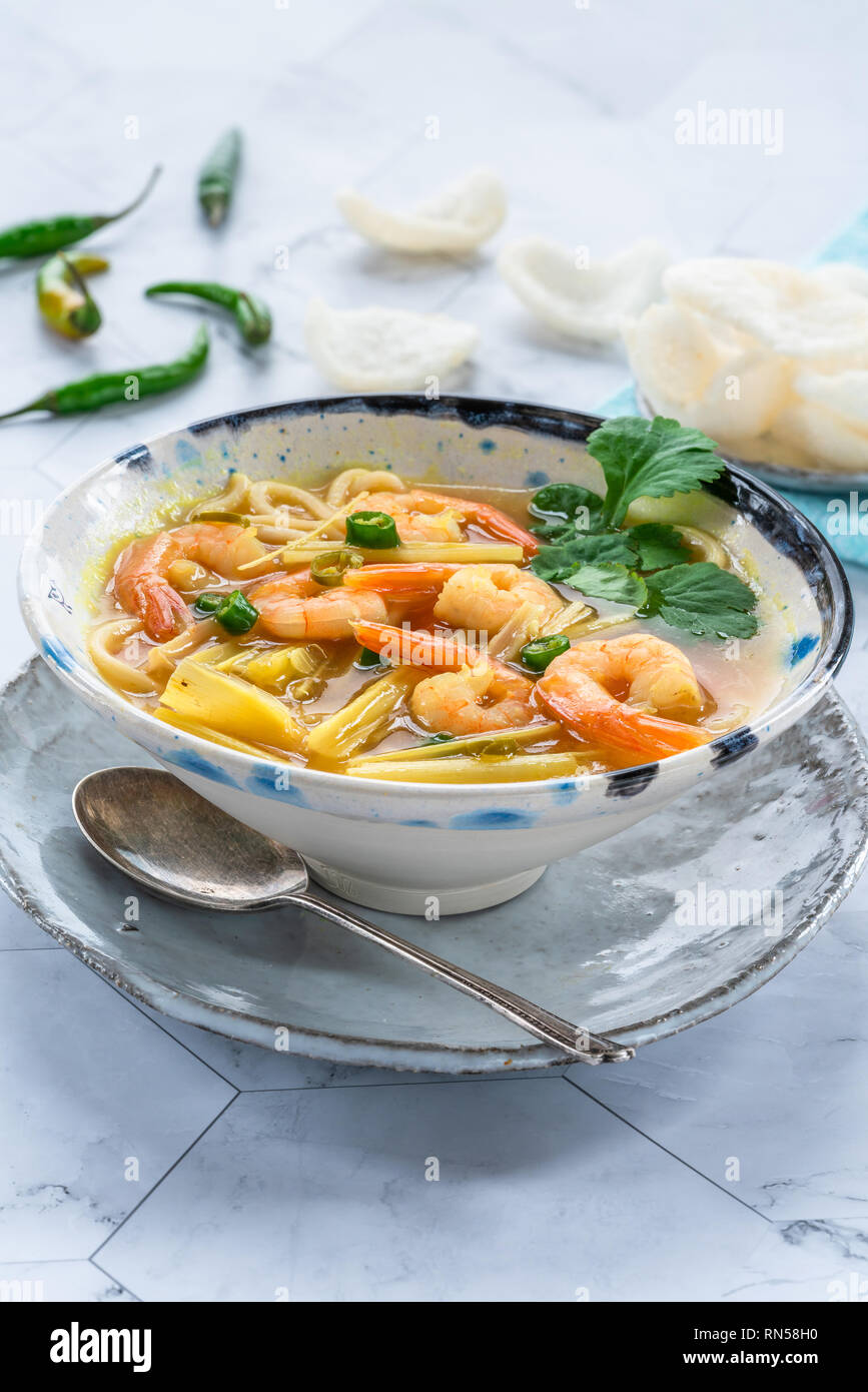 Tom yum - hot and sour Thai soup with prawns Stock Photo - Alamy