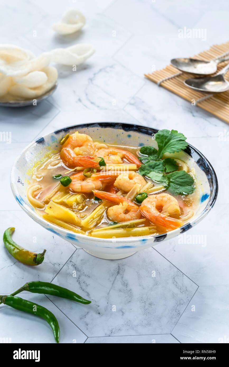 Tom yum - hot and sour Thai soup with prawns Stock Photo - Alamy