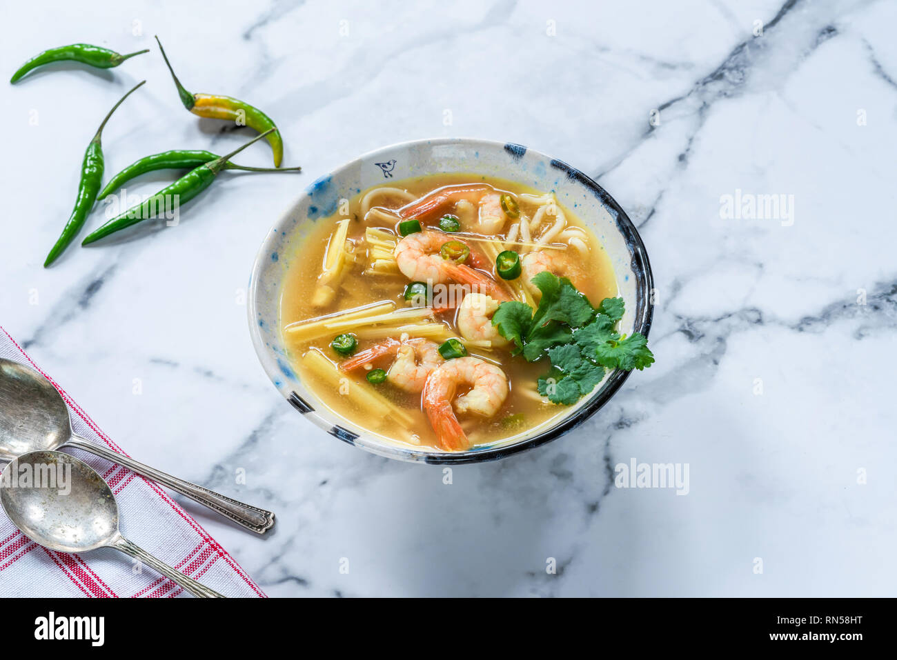Tom yum - hot and sour Thai soup with prawns Stock Photo - Alamy