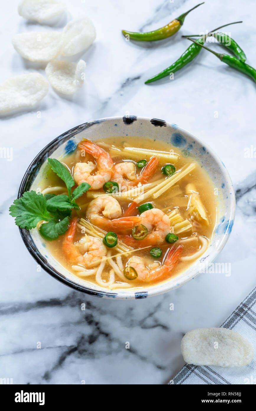 Tom yum - hot and sour Thai soup with prawns Stock Photo - Alamy