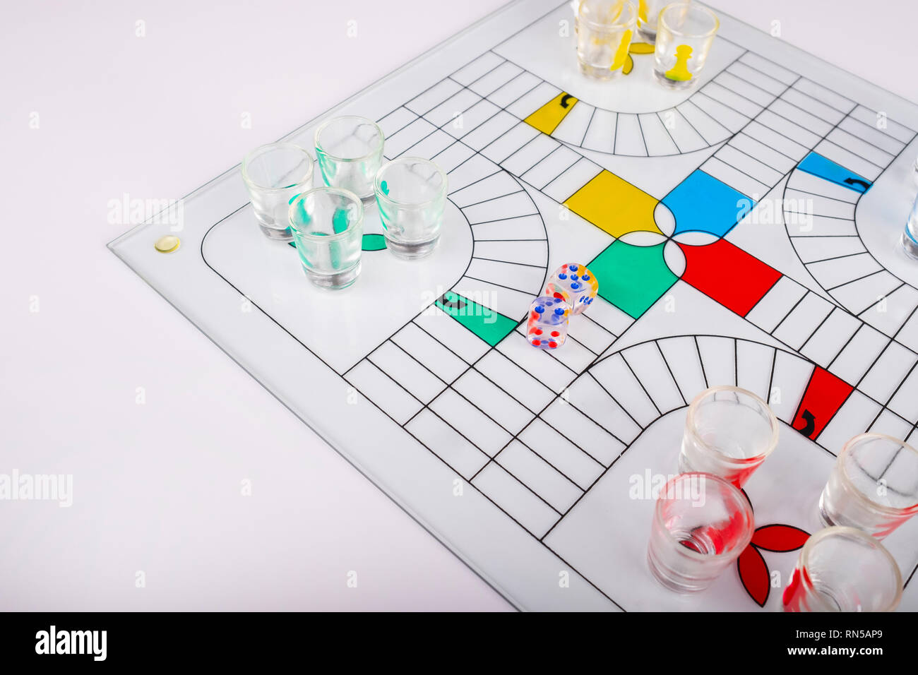 typical set of glass parchis on bench background Stock Photo - Alamy