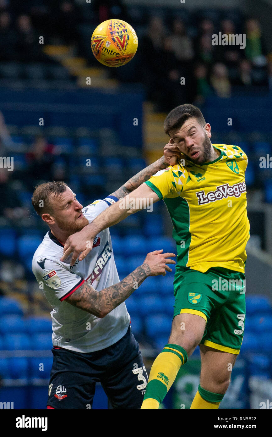 Norwich City Grant Hanley battles with Bolton Wanderers David Wheater (C)   16th February 2019, University of Bolton Stadium, Bolton, England; Sky Bet Championship, Bolton Wonderers vs Norwich City ;    Credit: Terry Donnelly /News Images  English Football League images are subject to DataCo Licence Stock Photo