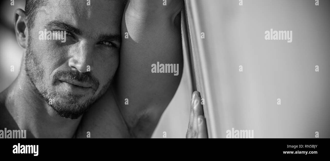 Handsome Caucasian Male Model Posing On The Beach wall Stock Photo Alamy