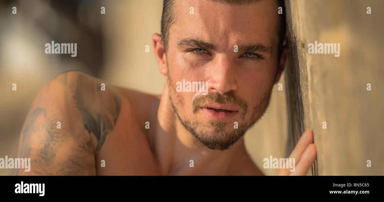 Handsome Caucasian Male Model Posing On The Beach wall Stock Photo Alamy