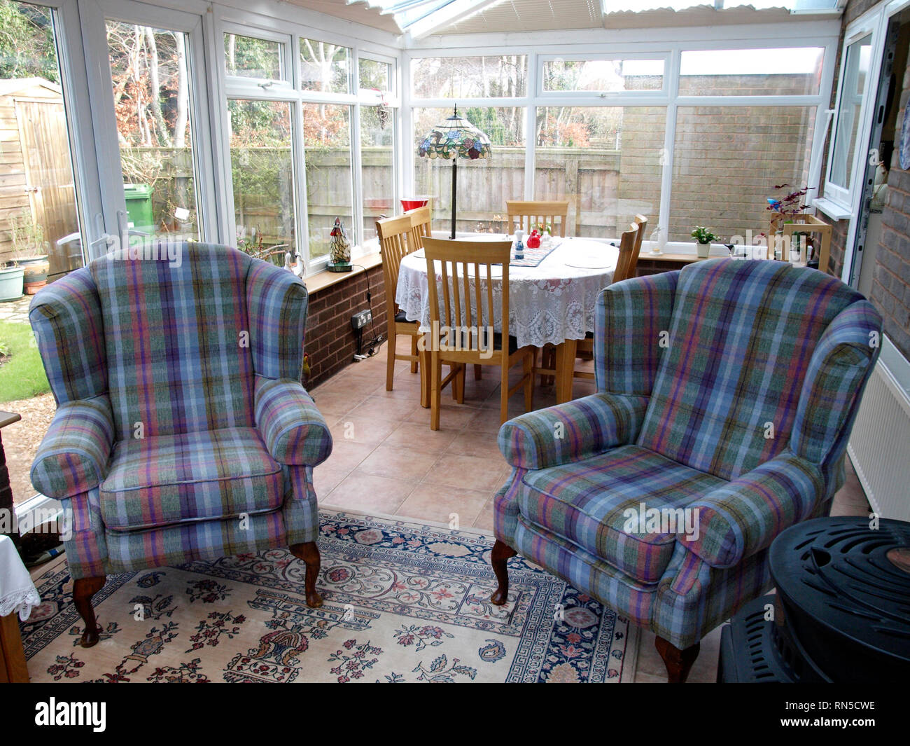 Two armchairs in a conservatory, UK Stock Photo