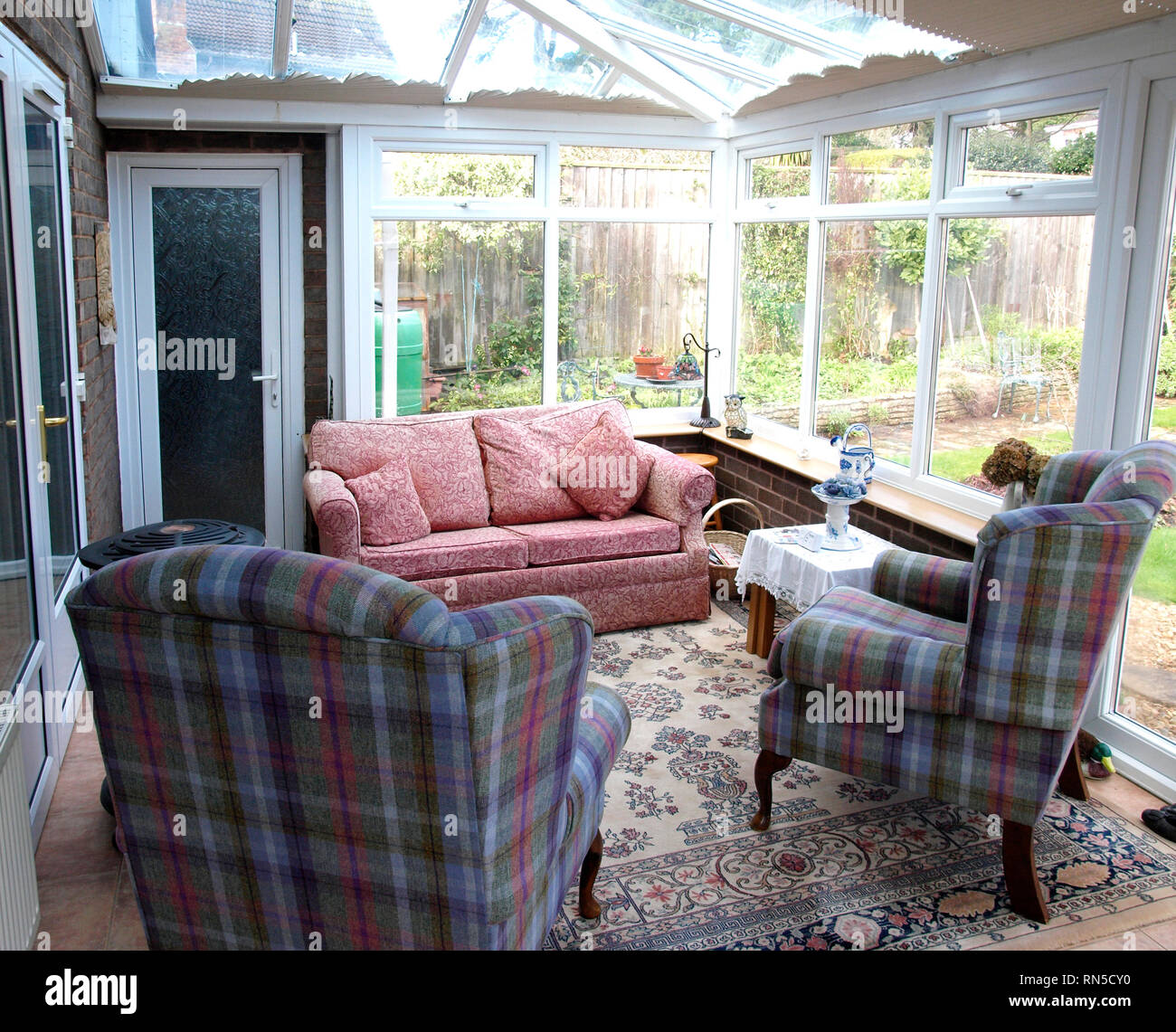 Sofa and armchairs in a Conservatory, UK Stock Photo