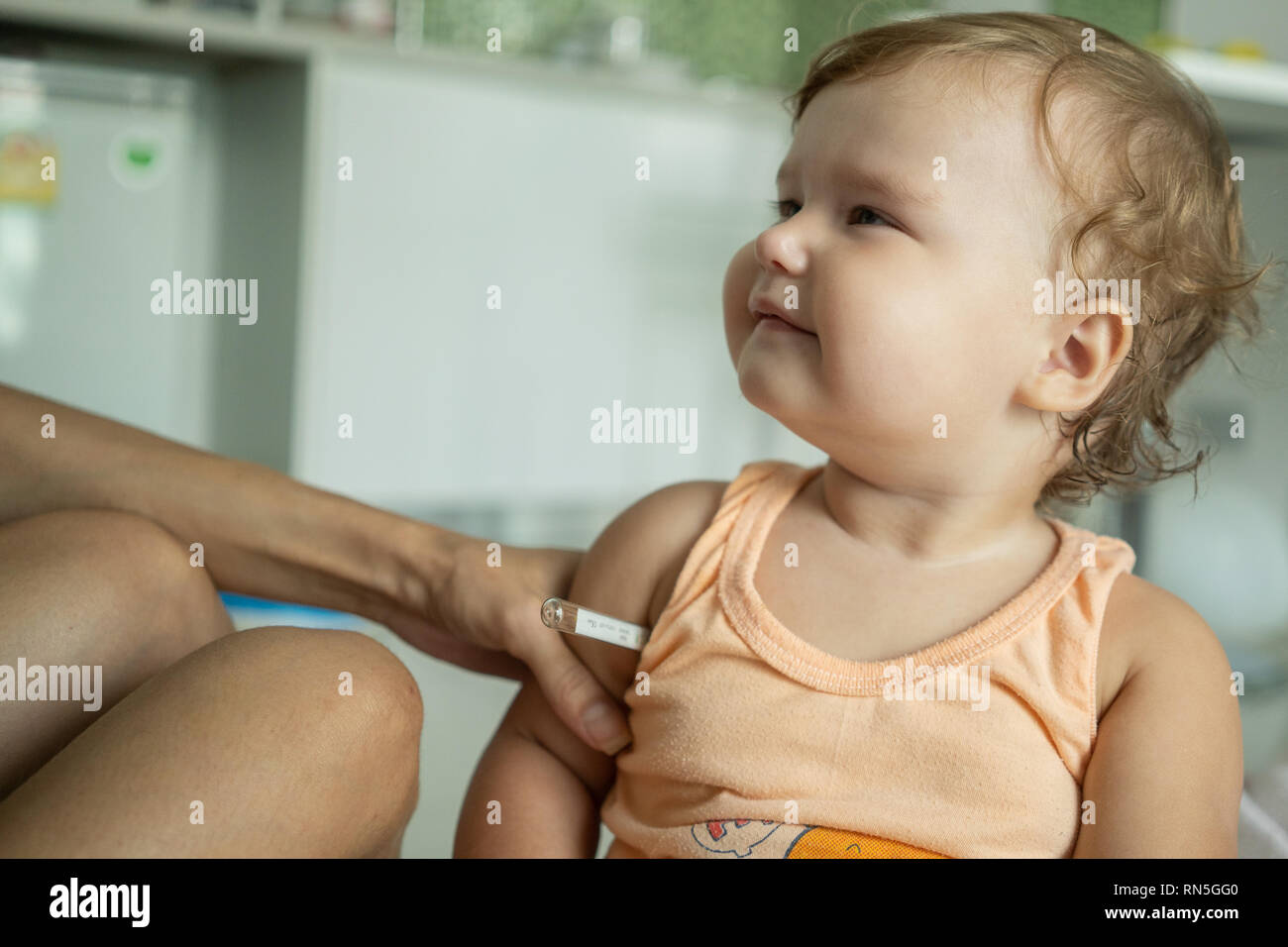 The child put a thermometer. Temperature measurement Stock Photo Alamy