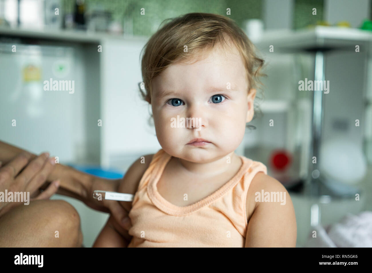The child put a thermometer. Temperature measurement Stock Photo Alamy