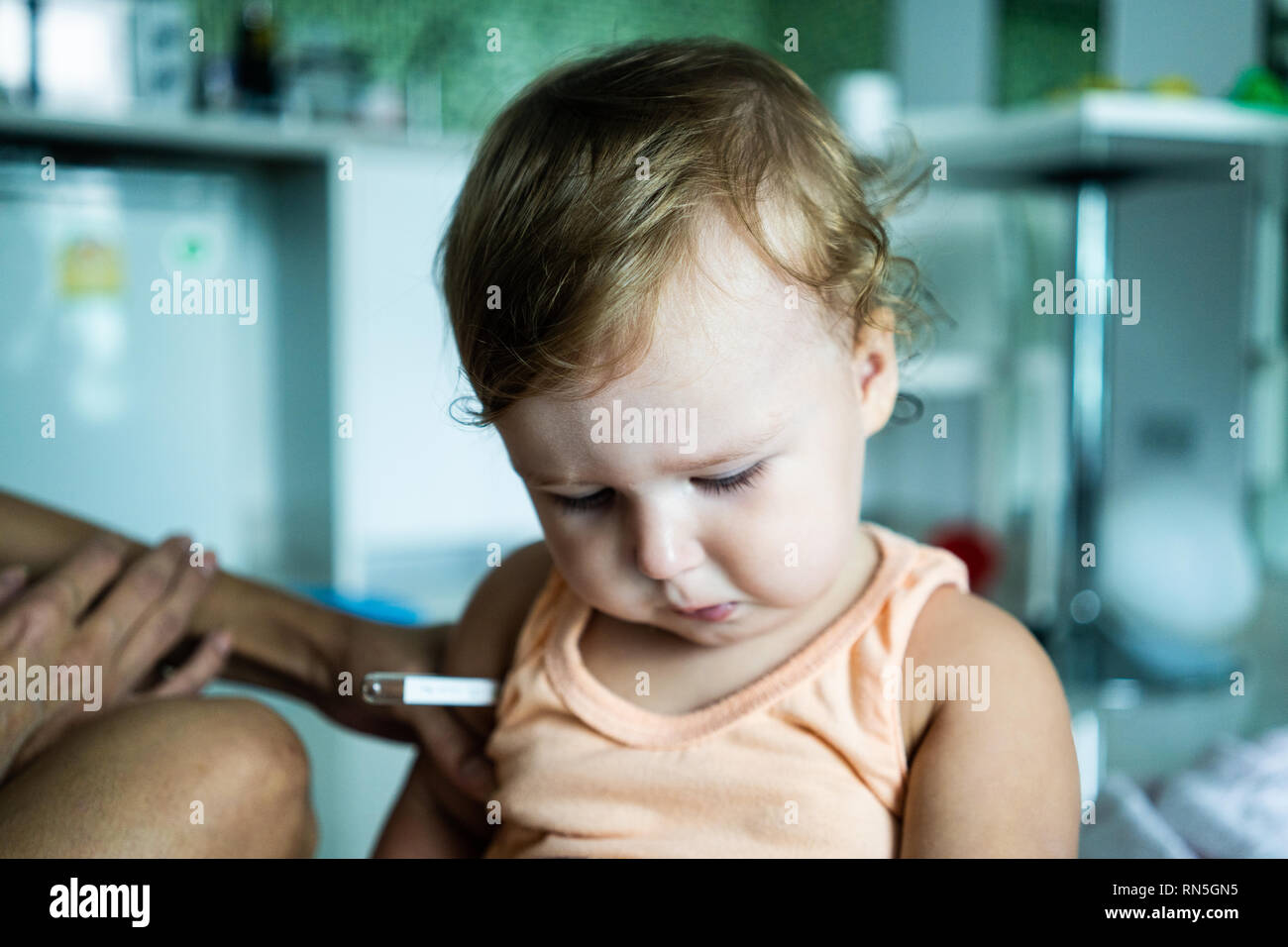 The child put a thermometer. Temperature measurement Stock Photo Alamy