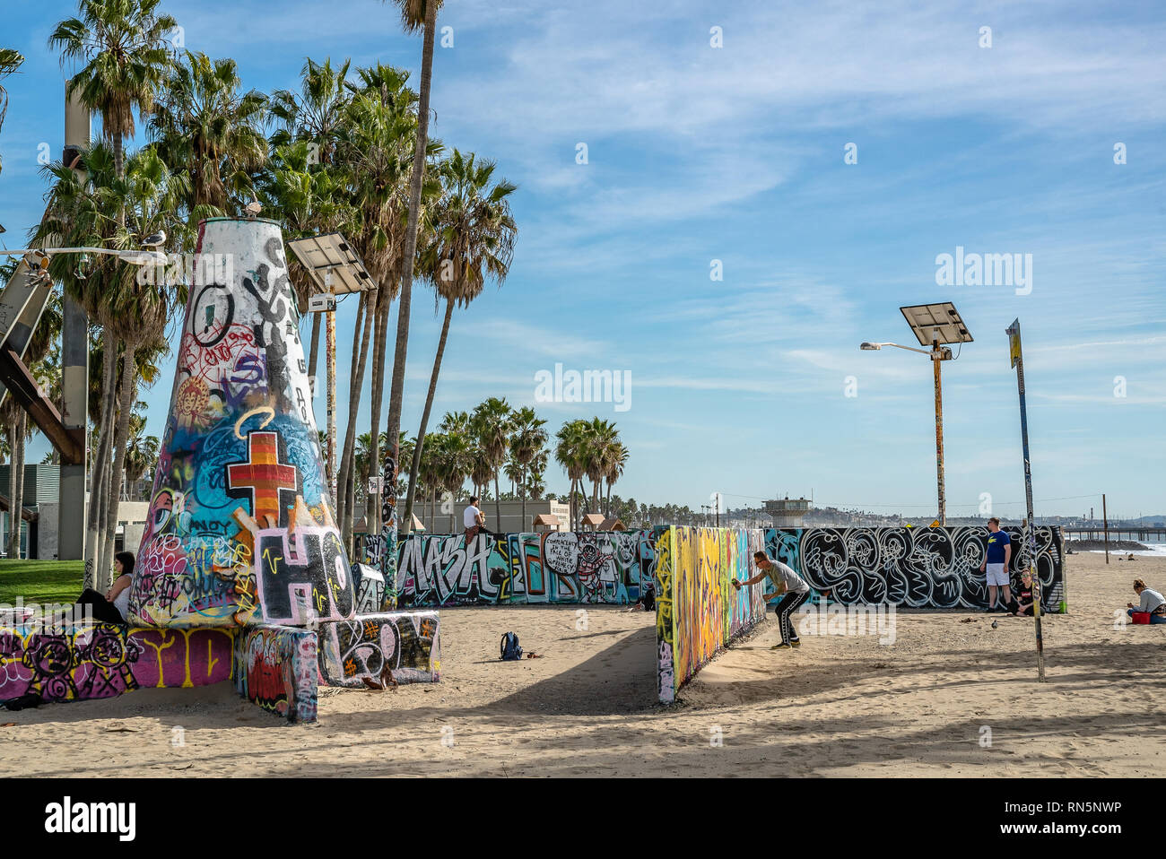Wall of graffiti at Venice Beach Los Angeles California USA Palm Trees in the back Stock Photo