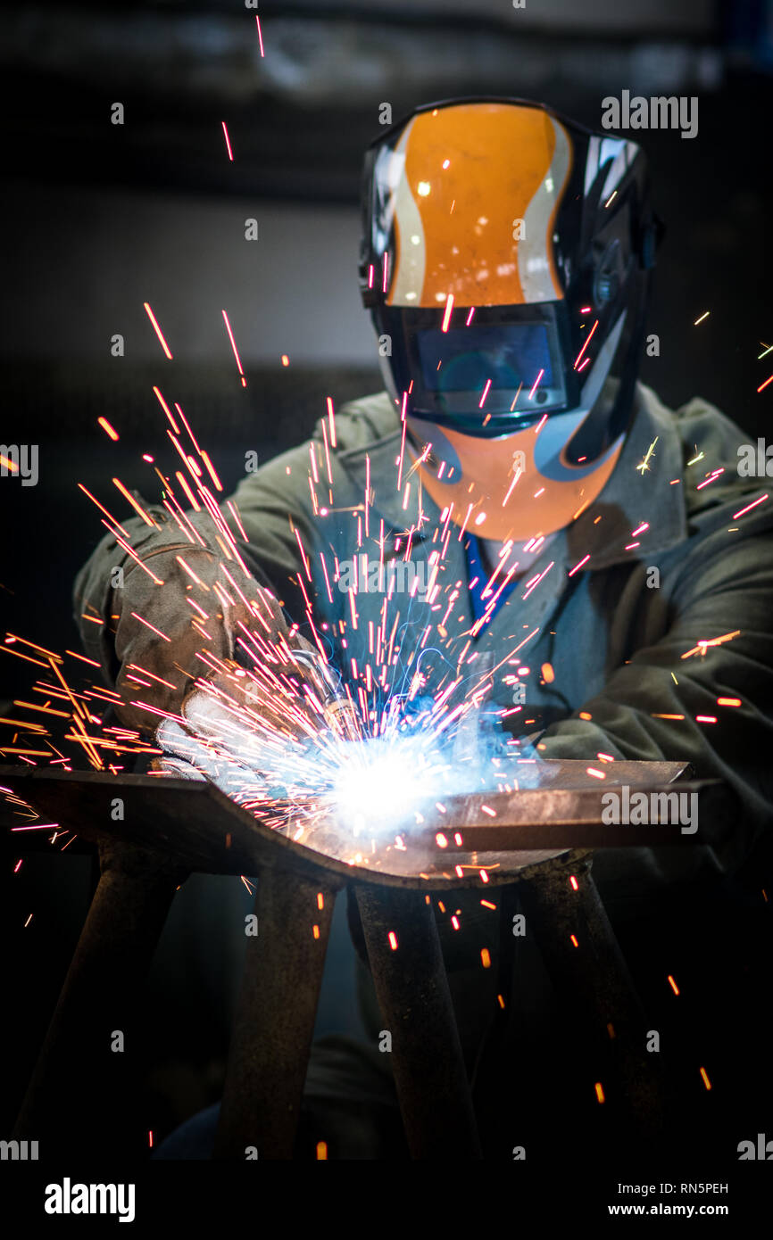 industrial worker at the factory welding steel construction Stock Photo