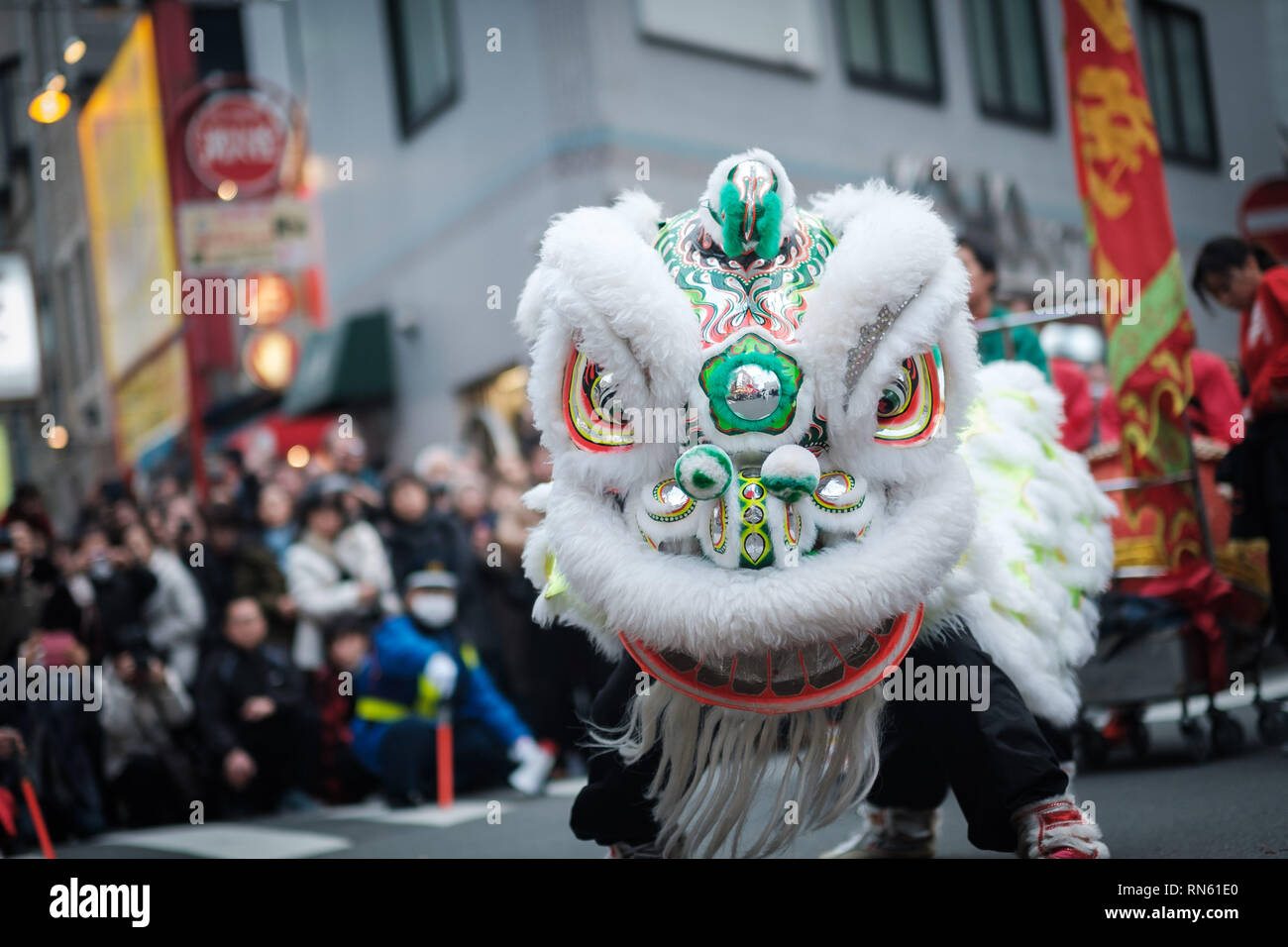 People perform lion's dance in the street of Yokohama's Chinatown on February 16, 2019. Extravagant parade to celebrate the New Year with costumes of the Emperor, ethnic clothing, lion dance, and dragon dance. February 16, 2019 Credit: Nicolas Datiche/AFLO/Alamy Live News Stock Photo