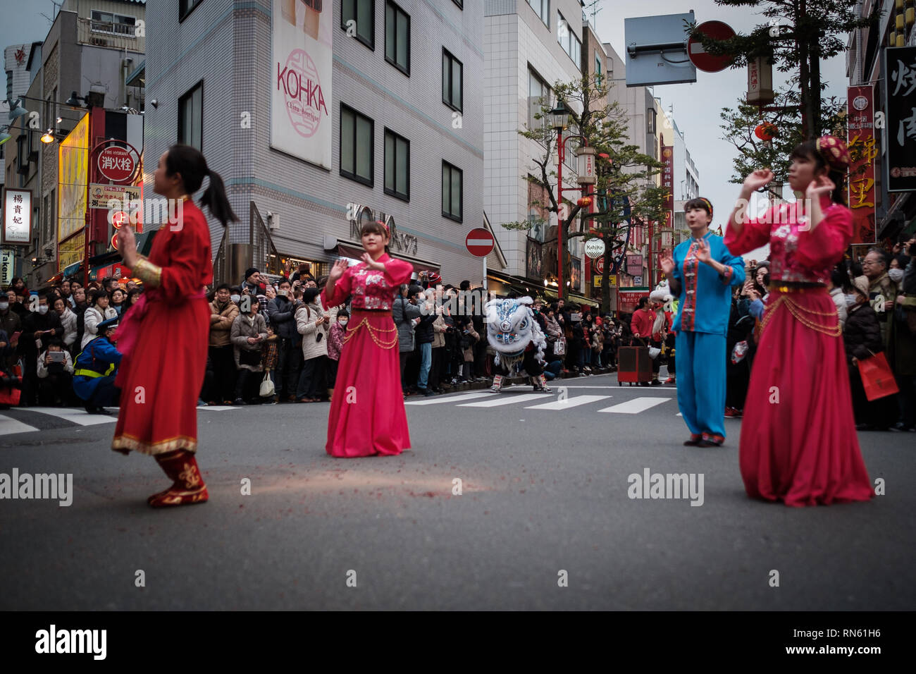 People parade in the street of Yokohama's Chinatown on February 16, 2019. Extravagant parade to celebrate the New Year with costumes of the Emperor, ethnic clothing, lion dance, and dragon dance. February 16, 2019 Credit: Nicolas Datiche/AFLO/Alamy Live News Stock Photo