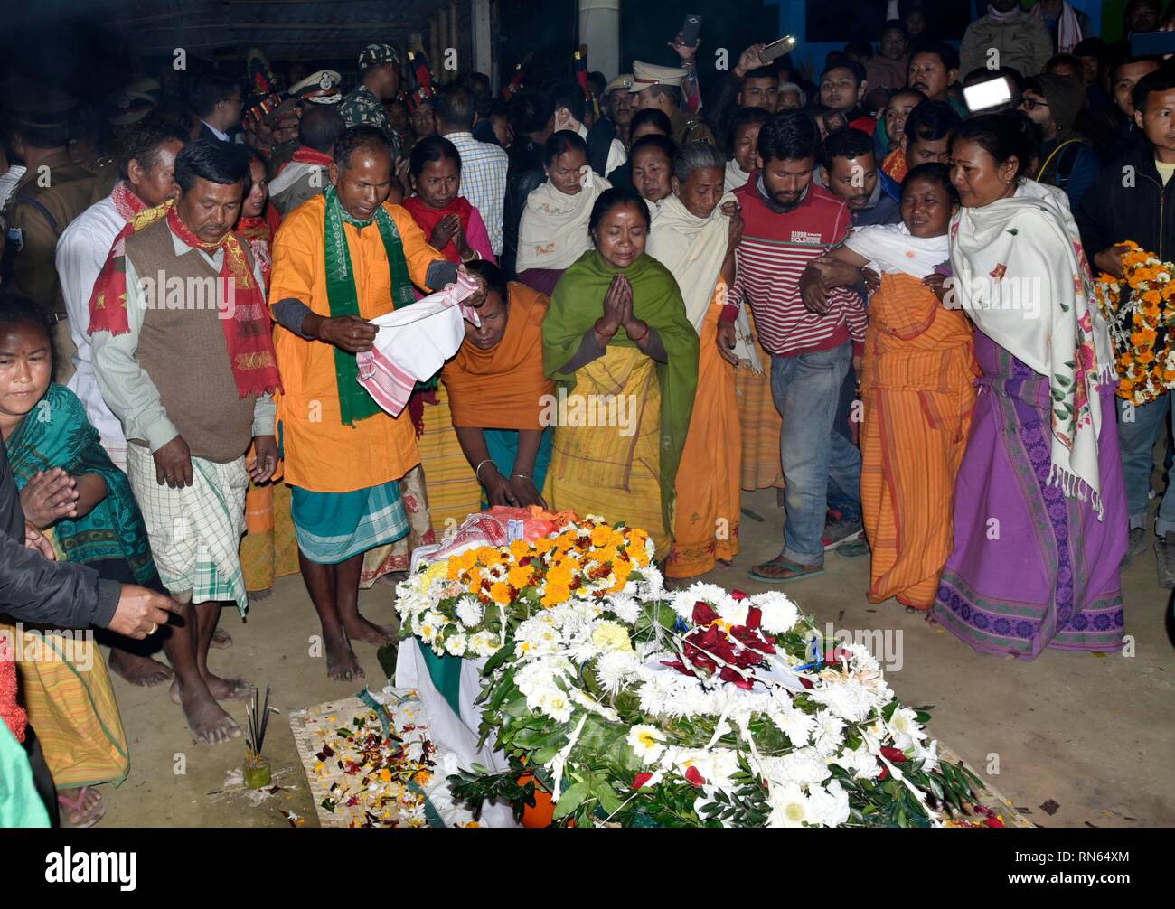 Assam, India. 16th Feb, 2019. Martyr Maneshwar Basumatary. Baksa, Assam, India. 16February 2019. Family members and relatives of slain Central Reserve Police Force (CRPF) soldier, Maneshwar Basumatary mourn near his coffin before his cremation ceremony at village Tamulpur in Baksa district, Assam, India, 16 February 2019. At least 44 Indian paramilitary Central Reserve Police Force personnel were killed and several injured when a Jaish-e-Mohammed militant rammed an explosive-laden vehicle into a CRPF convoy along the Srinagar-Jammu highway at Lethpora area in South Kashmir's Pulwama district o Stock Photo