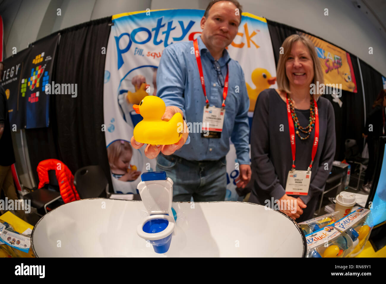 New York, USA. 17th Feb, 2019. Co-inventors Fred Longenecker and Shelly Mann demonstrate the Pottyduck toilet training toy at The 116th North American International Toy Fair in the Jacob Javits Convention center in New York on Sunday, February 17, 2019. The four day trade show with over 1000 exhibitors connects buyers and sellers and draws tens of thousands of attendees. The toy industry generates over $26 billion in the U.S. alone and Toy Fair is the largest toy trade show in the Western Hemisphere. ( © Richard B. Levine) Credit: Richard Levine/Alamy Live News Stock Photo