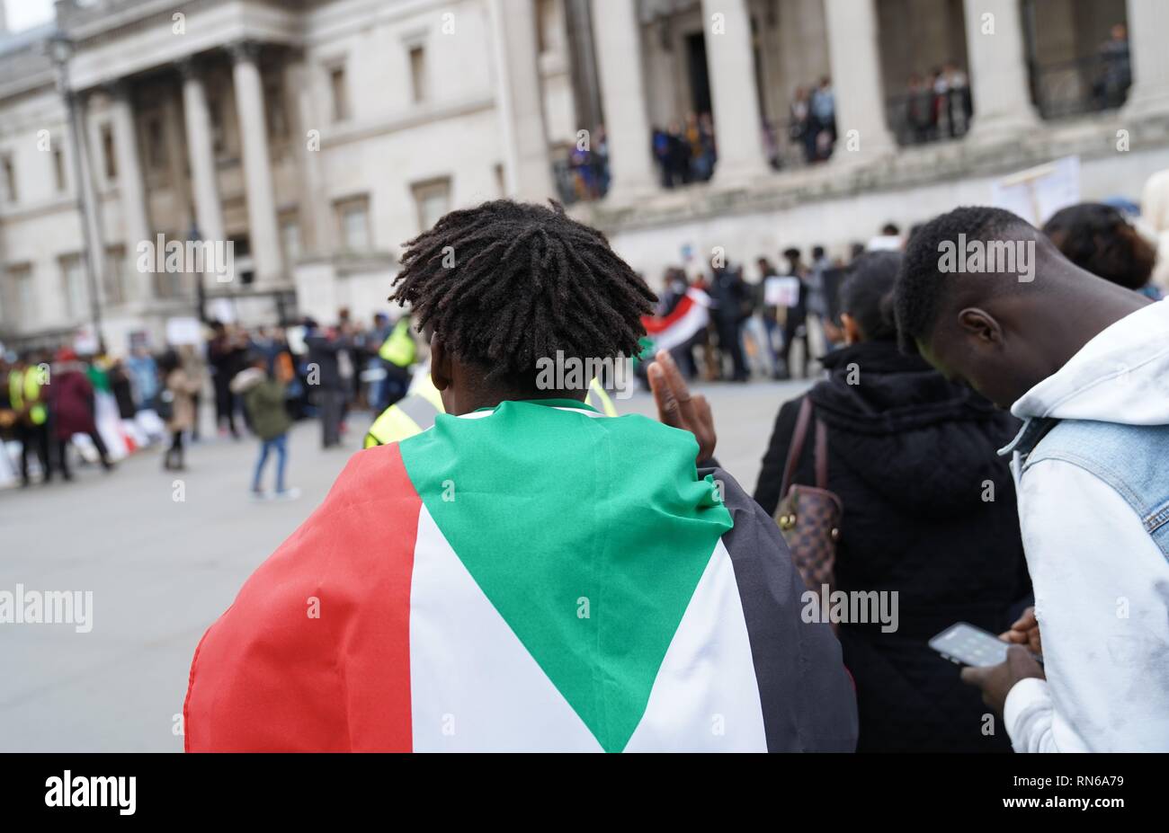 Trafalgar Square, London, UK. 16th Feb 2019. Photograph taken in central London during a protest organised by the Sudanese population in the UK in order to overthrow the Sudanese regime which has reigned for about 30 years causing civil upheaval and genocides mostly in the South Sudan which now holds its independence. The county overall has suffered from justice ranging from hyperinflation to unlawful imprisonment. Credit: Ioannis Toutoungi/Alamy Live News Stock Photo