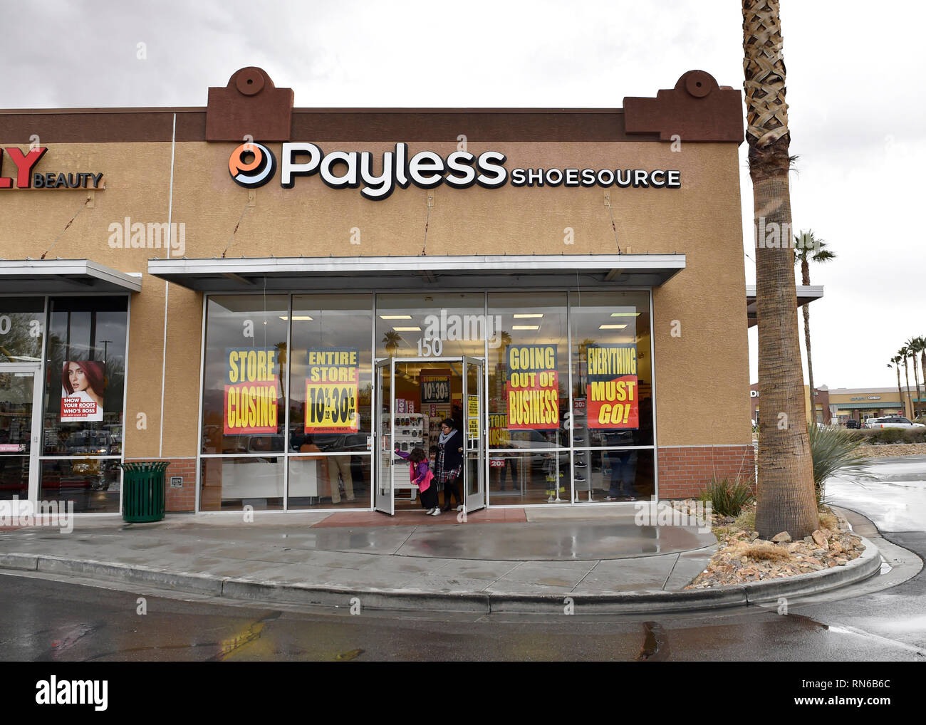 Las Vegas, Nevada, USA. 17th Feb, 2019. Customers exit a Payless ShoeSource store on February 17, 2019 in Las Vegas, Nevada. The Kansas based discount shoe store kicked off liquidation sales Sunday, attracting not only bargain shoppers but longtime fans of the store, which confirmed Friday it is ceasing all operations in the U.S. and Puerto Rico. Credit: David Becker/ZUMA Wire/Alamy Live News Stock Photo