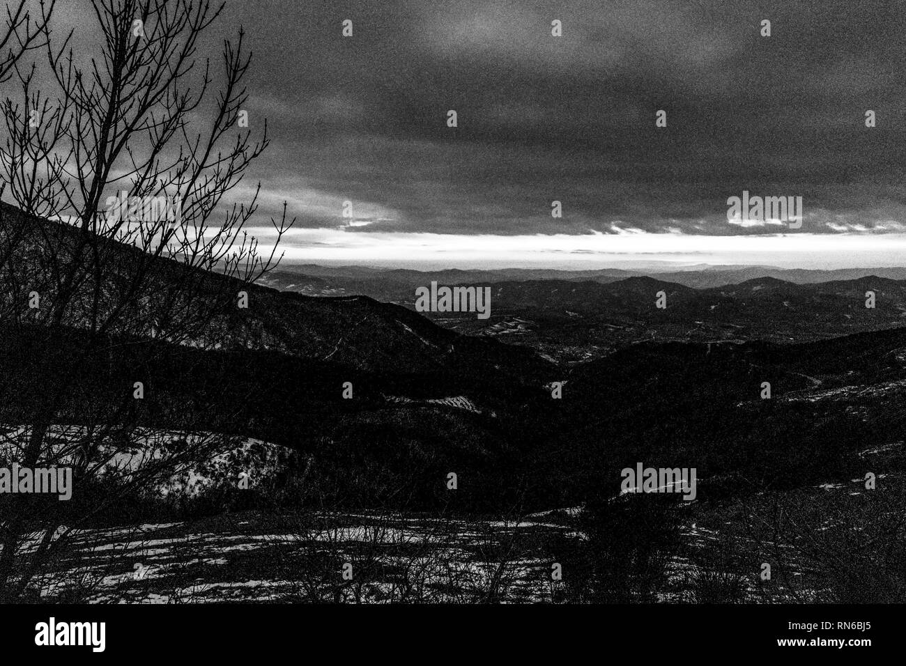 sky at dusk, with mountains layers Stock Photo