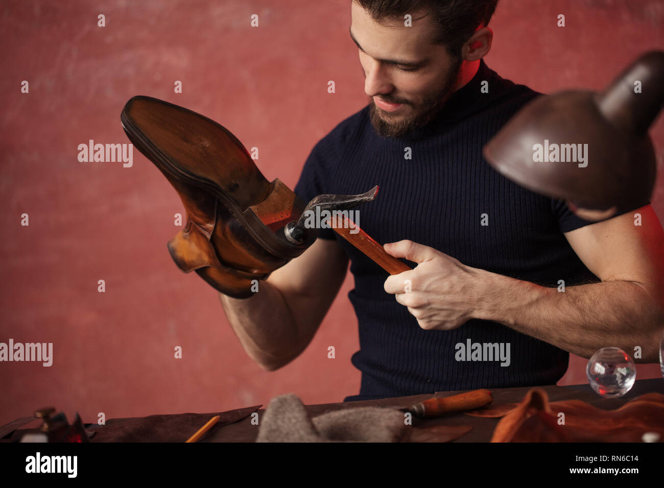 master making a new pair of shoes, close up photo, Stock Photo