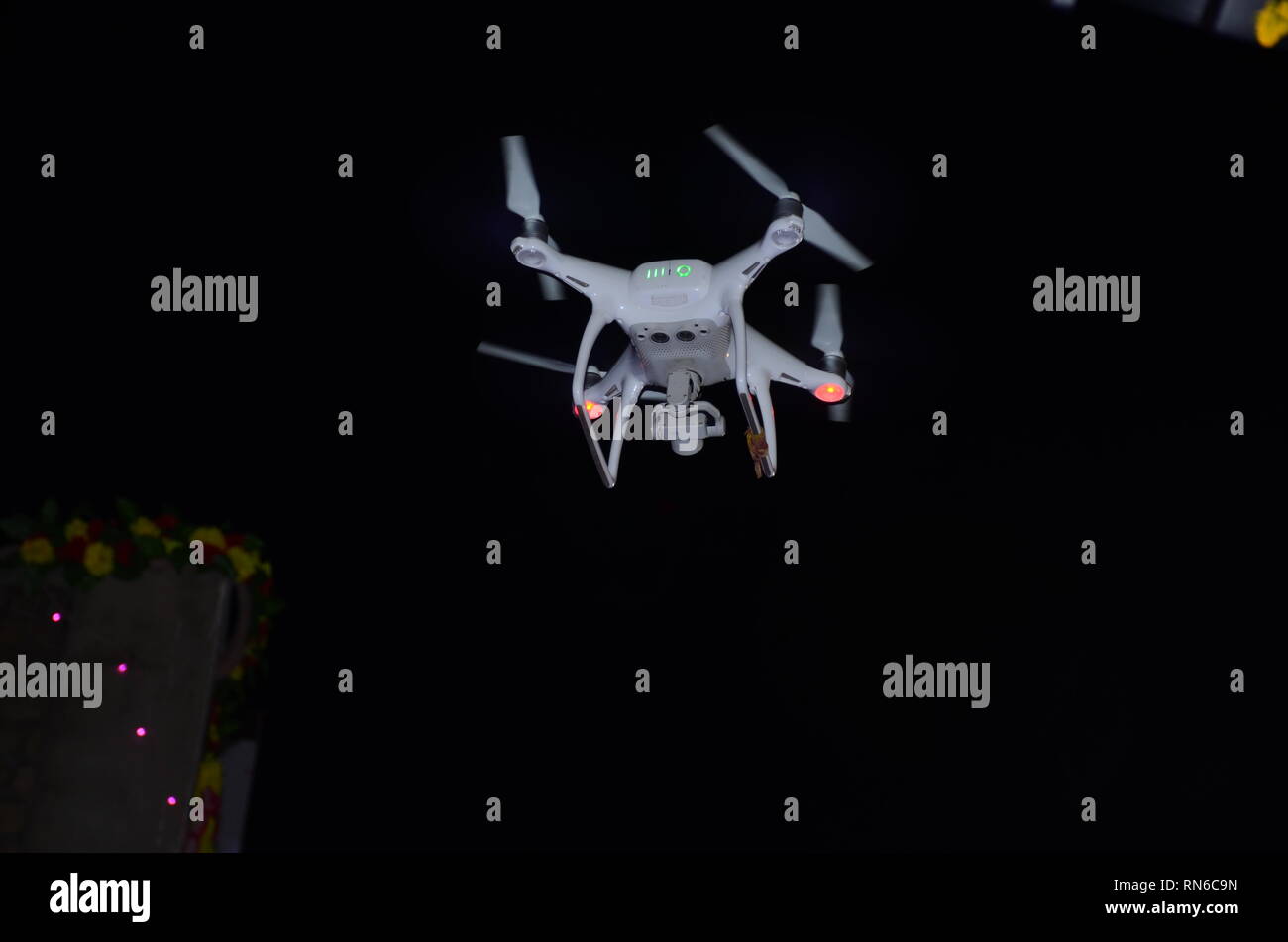 flying drone camera in night Stock Photo