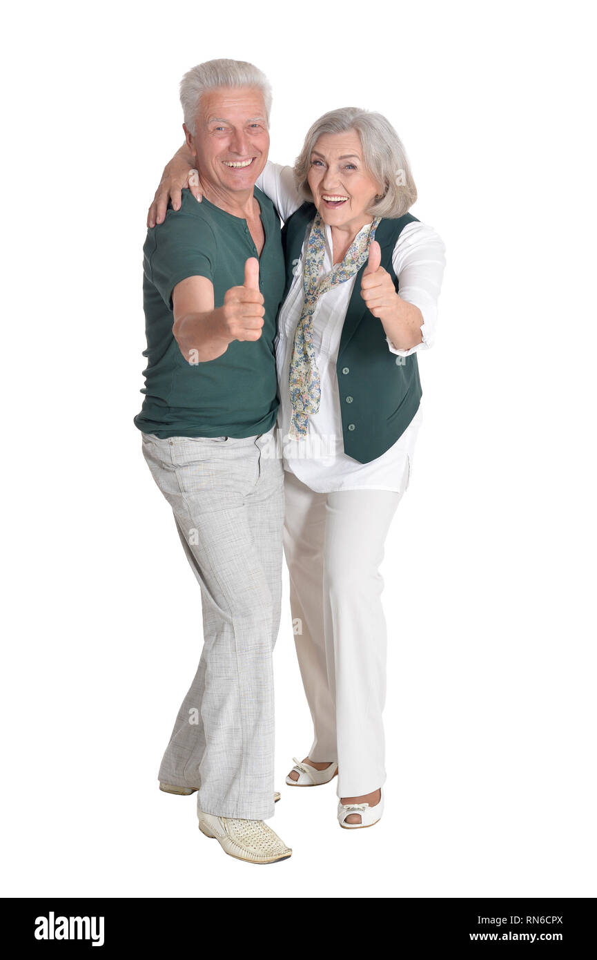 Portrait of senior couple with thumbs up isolated Stock Photo - Alamy