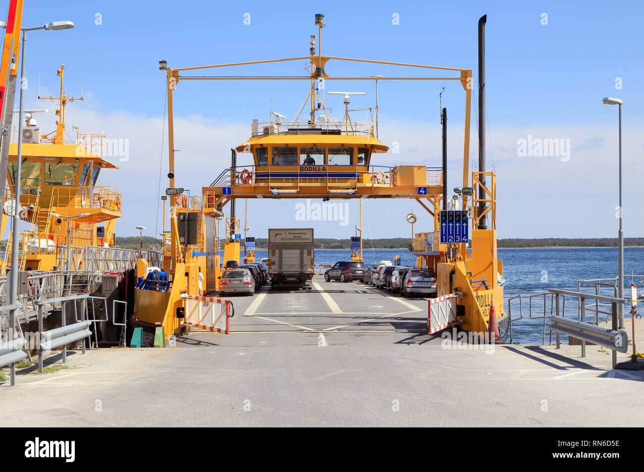 Farosund, Sweden - May 13, 2016: Public road-ferry at the berth in Farosund connecting the two islands Faro and Gotland. Stock Photo