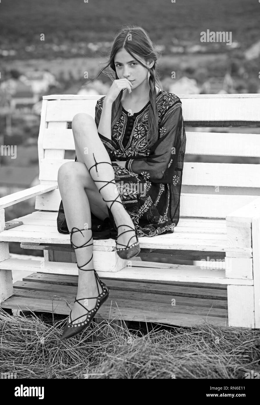 Young woman sit on bench on natural landscape, wanderlust Stock Photo ...