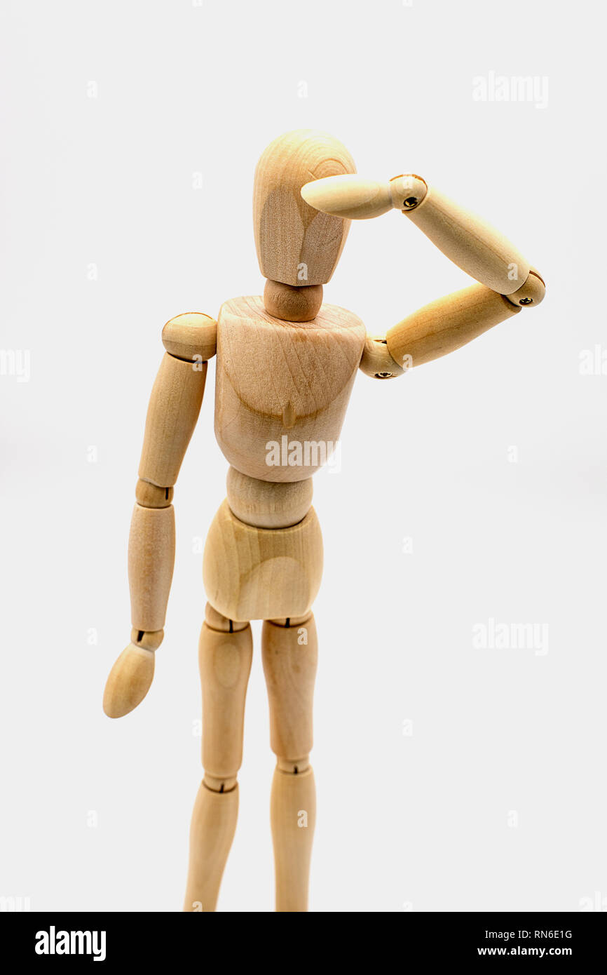 wooden dummy puppet keeping an eye out Stock Photo Alamy