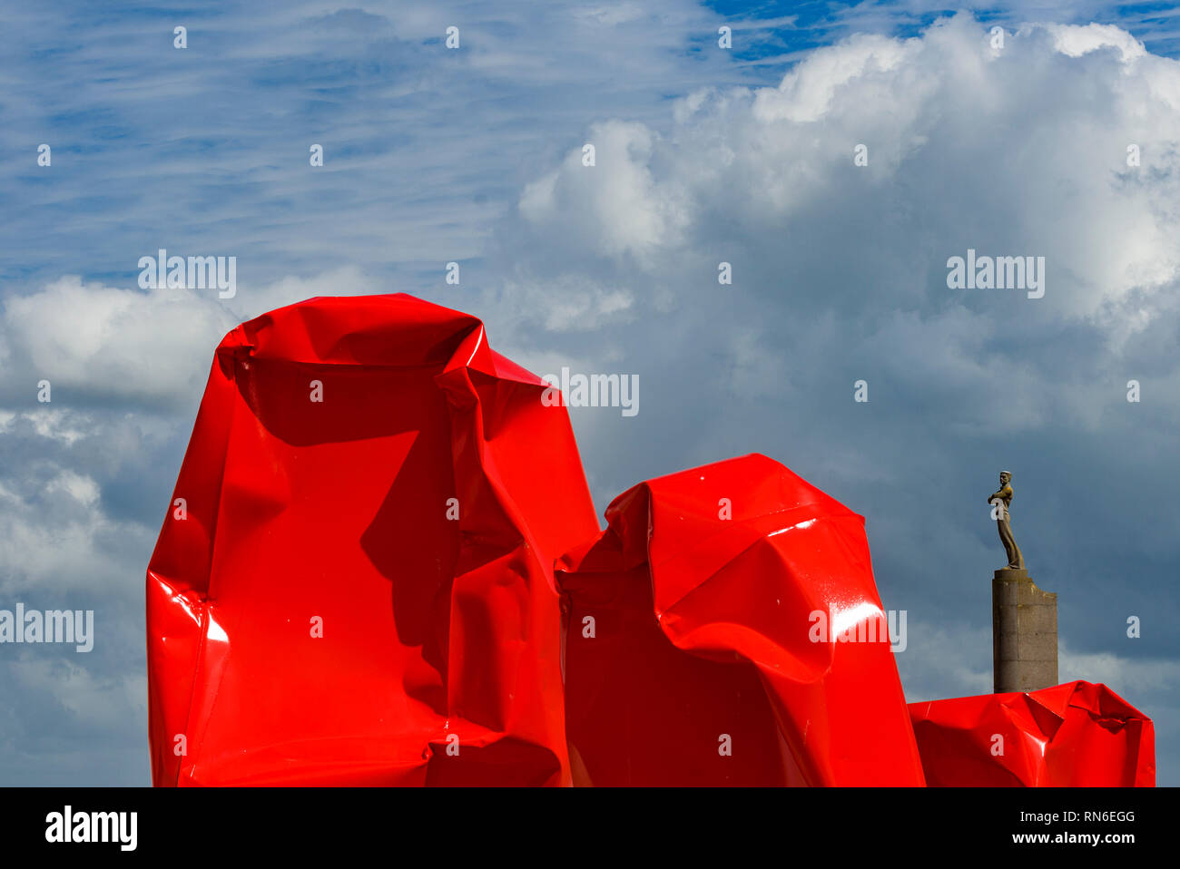 The Monument to Sailors on Zeeheldenplein Square and the Rock Strangers by Arne Quinze. Controversial modern art work on the dam of Ostend. Belgium Stock Photo