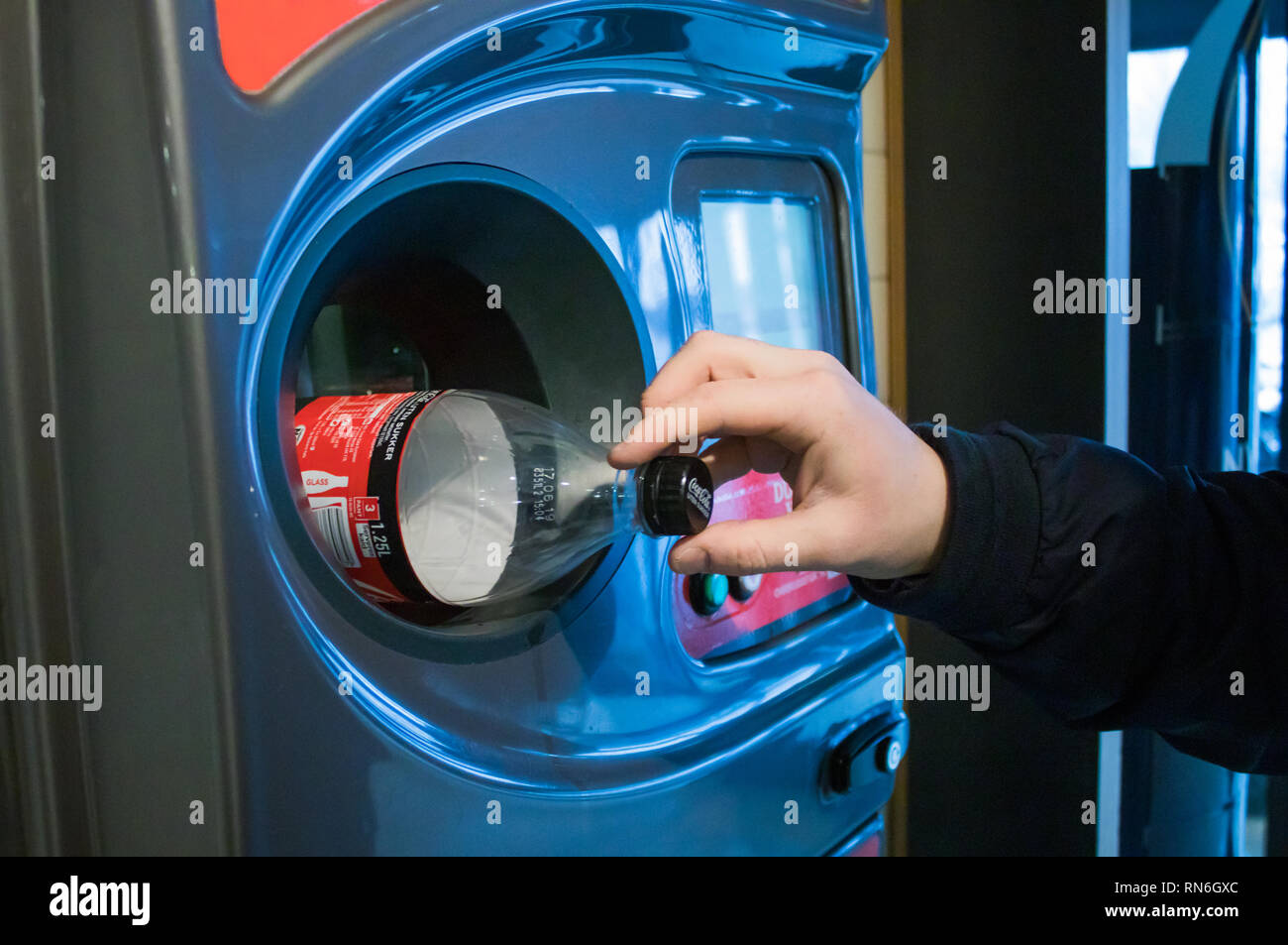 Recycling a Plastic Bottle in a Recycling Machine Stock Photo Alamy
