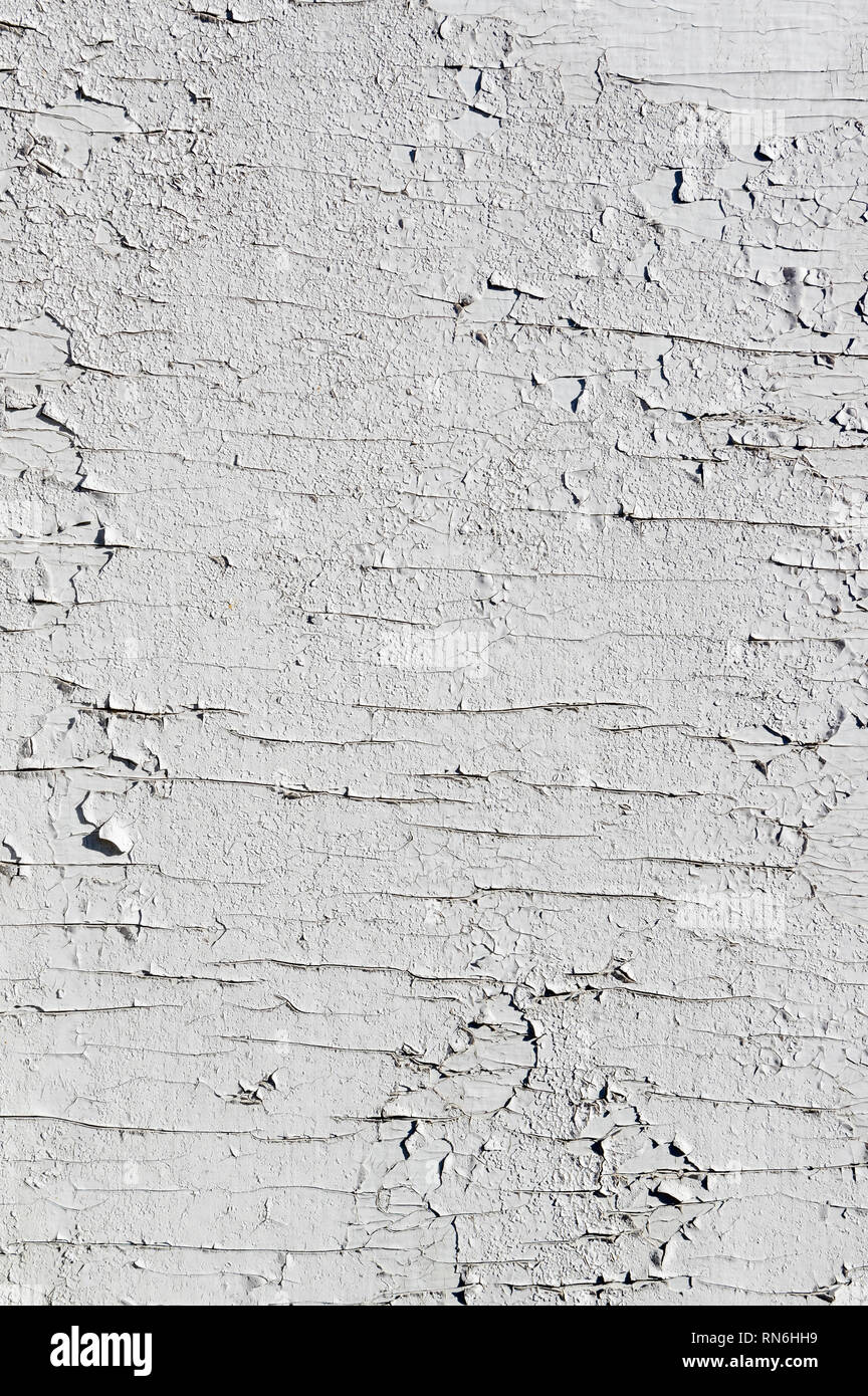 Texture of few layers of cracked, peeling off old white paint Stock Photo