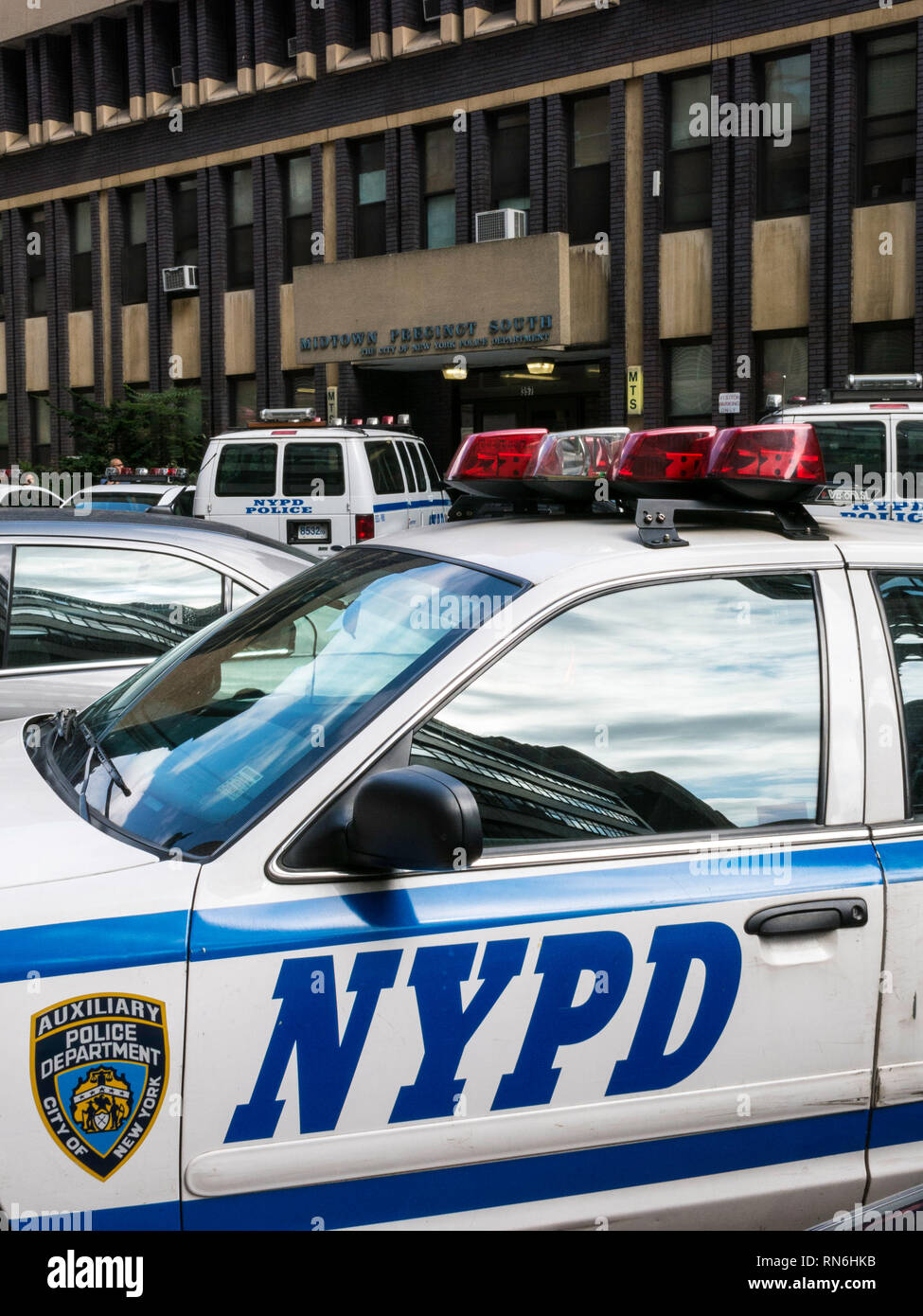 Police vehicles parked in front of Midtown Precinct South, New York City, USA Stock Photo